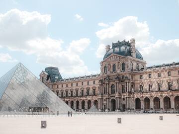 a large building with a glass pyramid