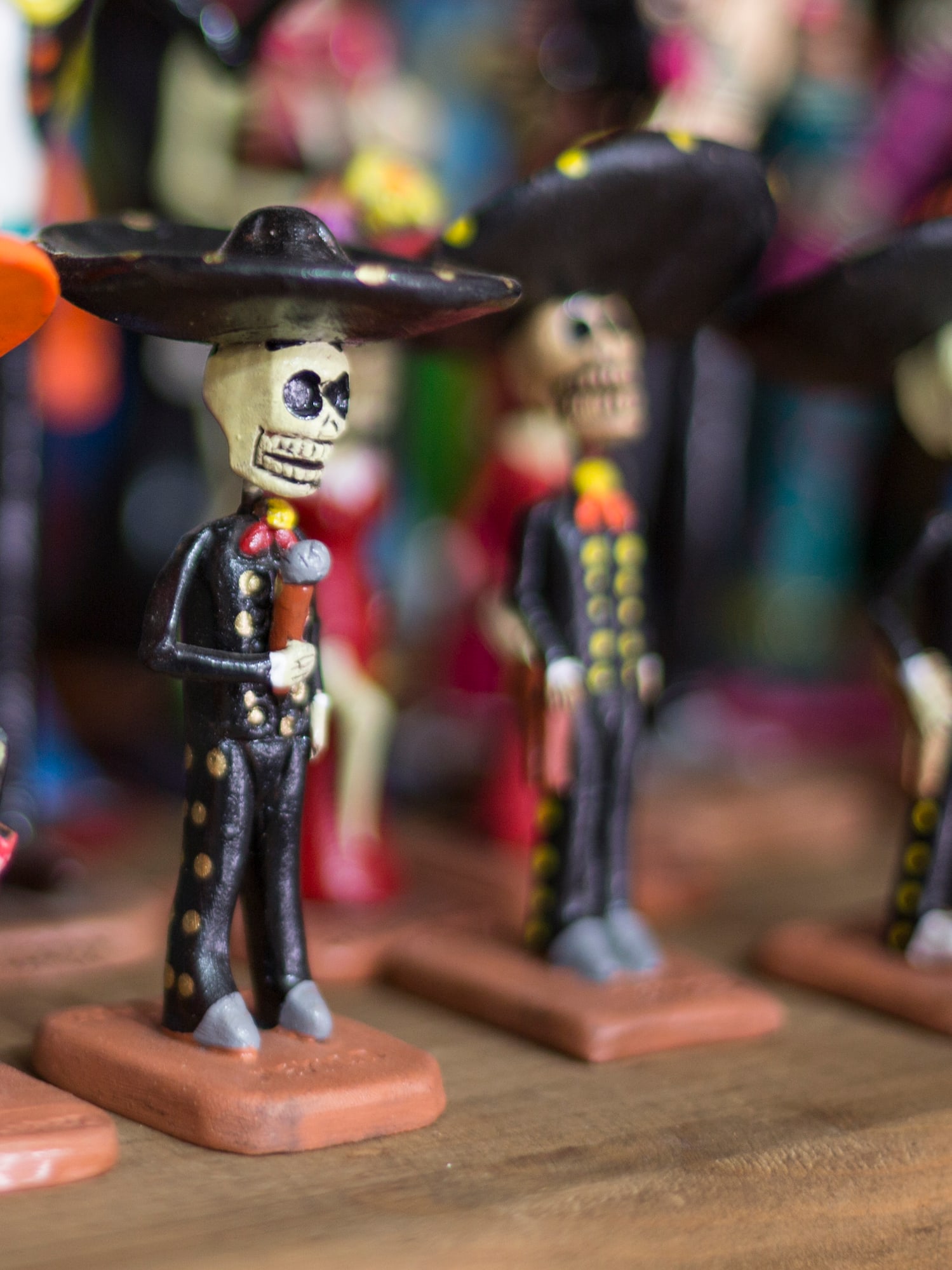 a group of small figurines of skeletons