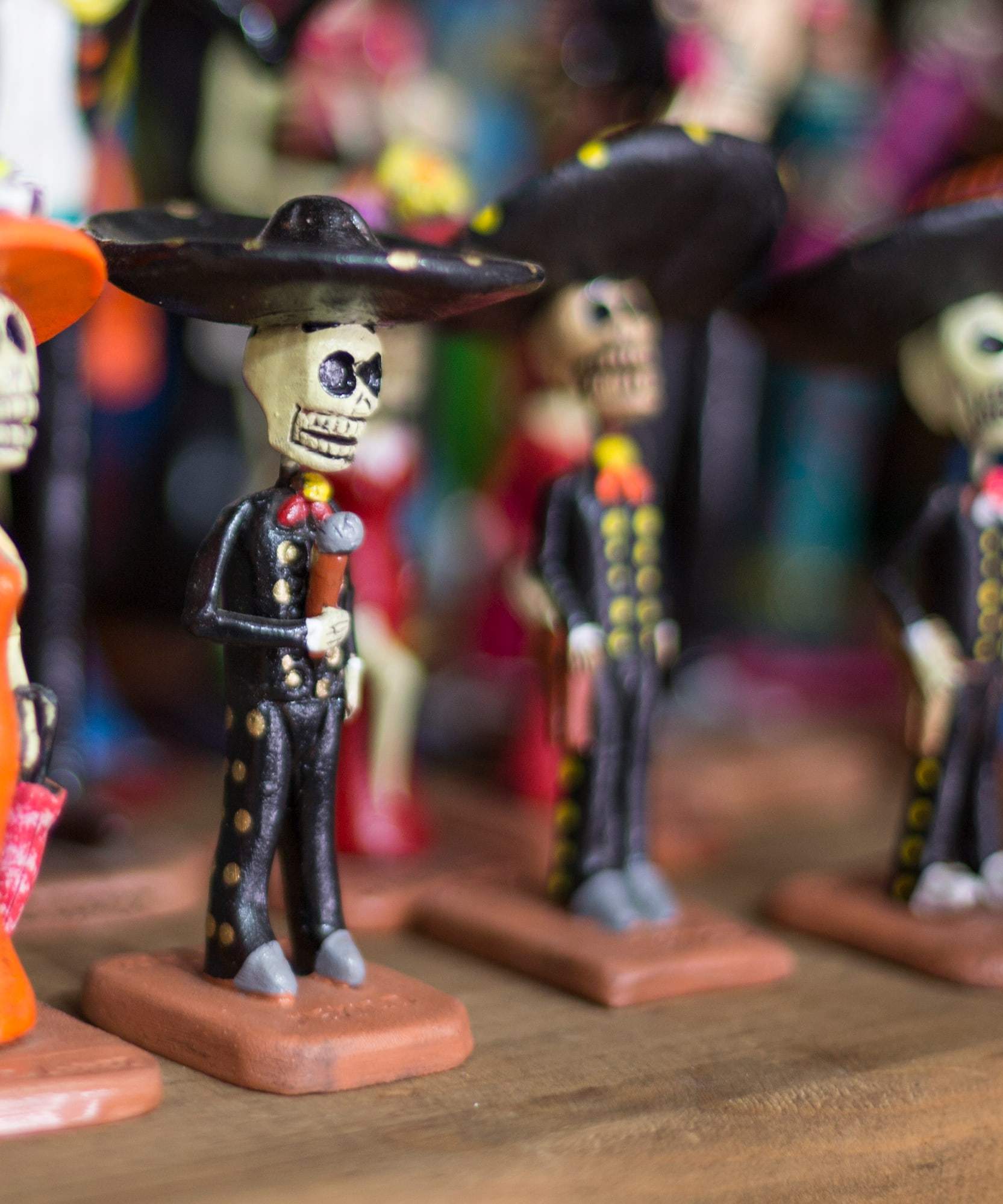 a group of small figurines of skeletons