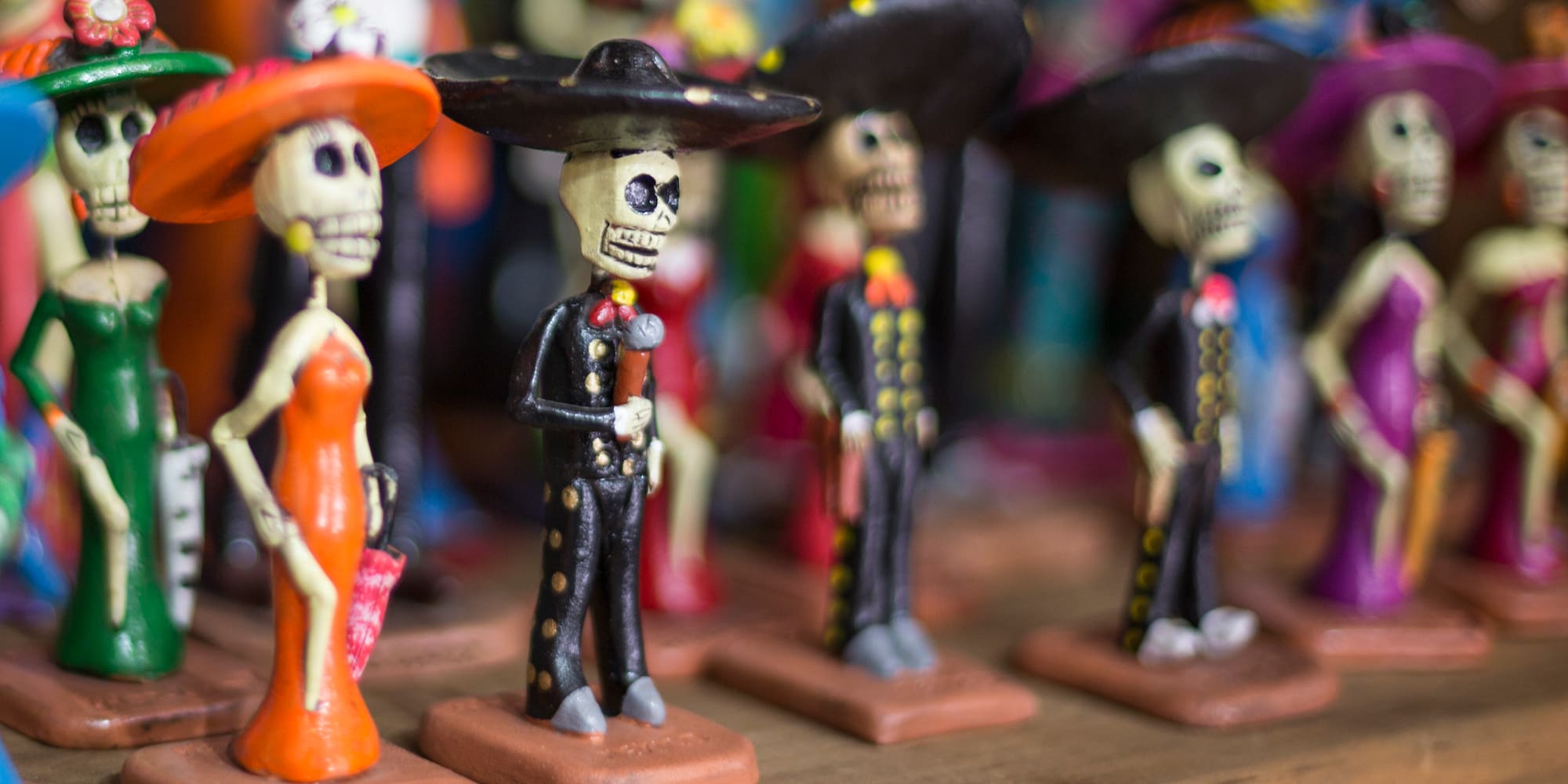 a group of small figurines of skeletons