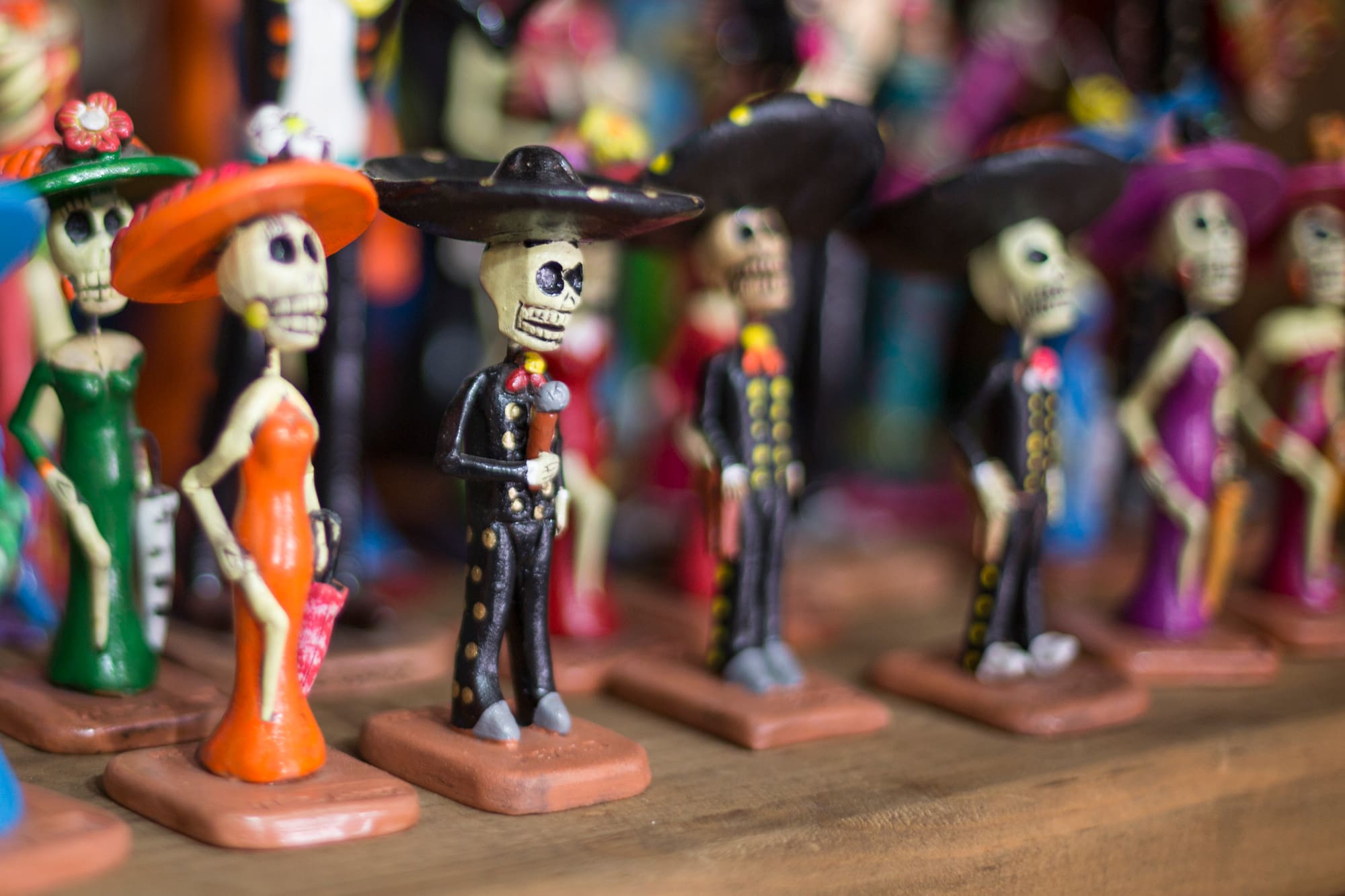 a group of small figurines of skeletons