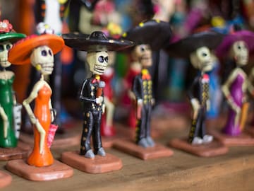 a group of small figurines of skeletons