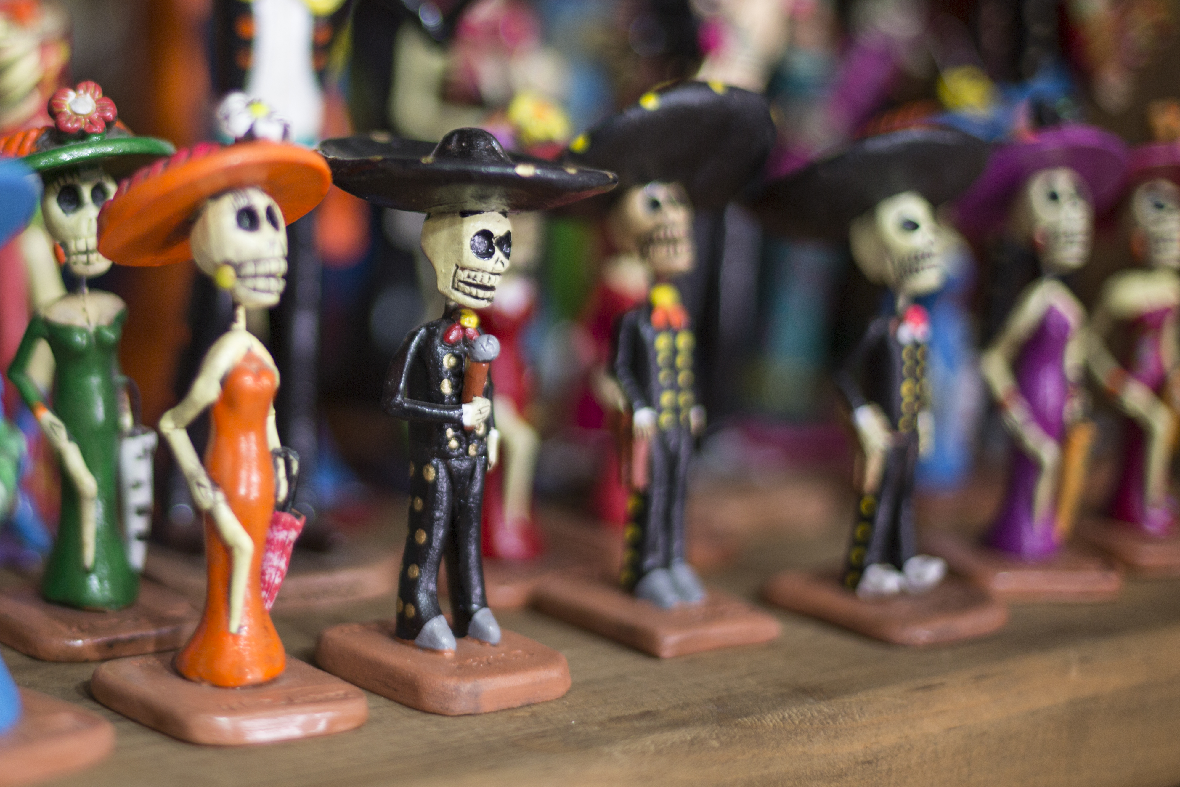 a group of small figurines of skeletons