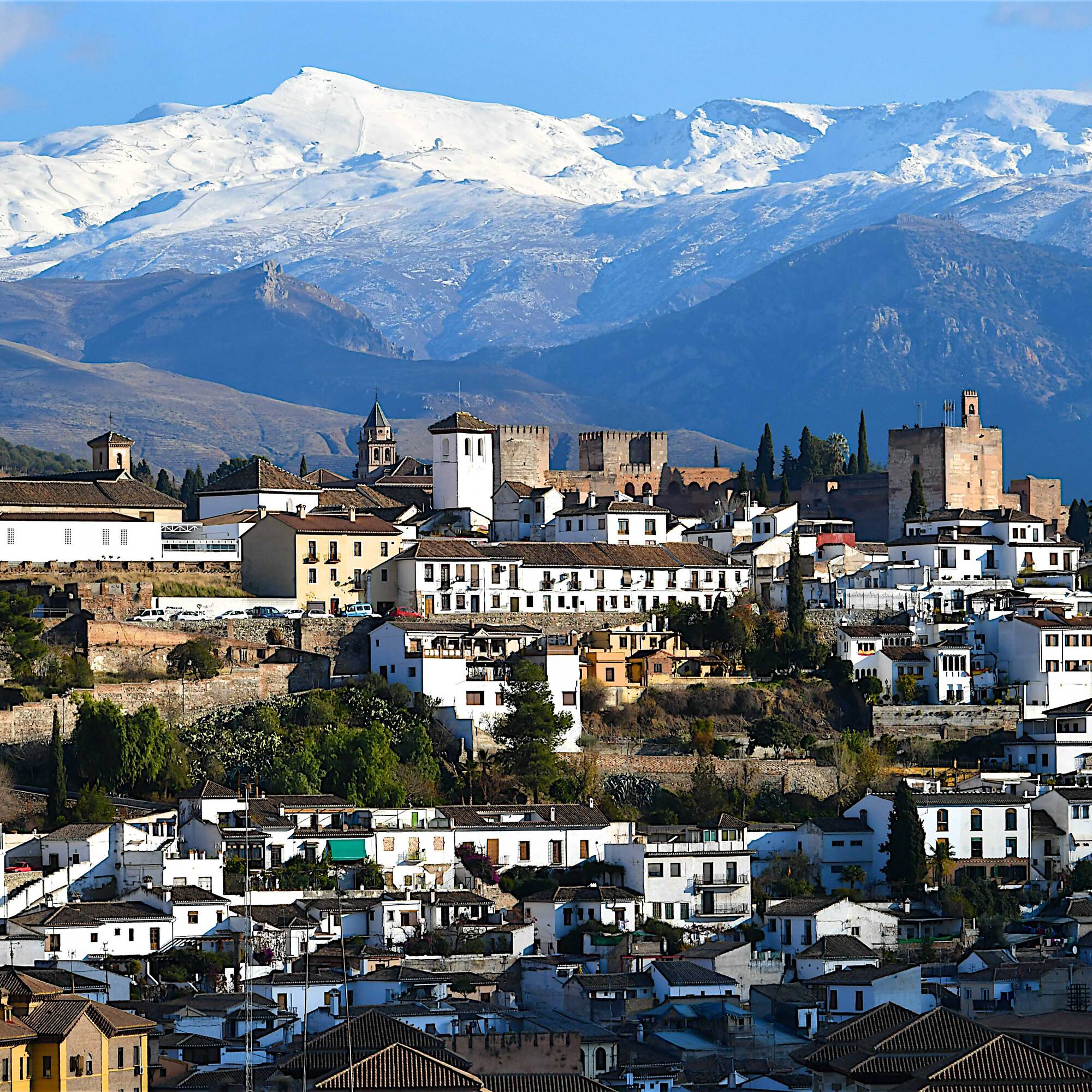a city with a mountain in the background
