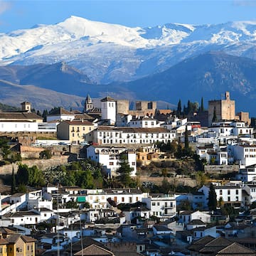 a city with a mountain in the background