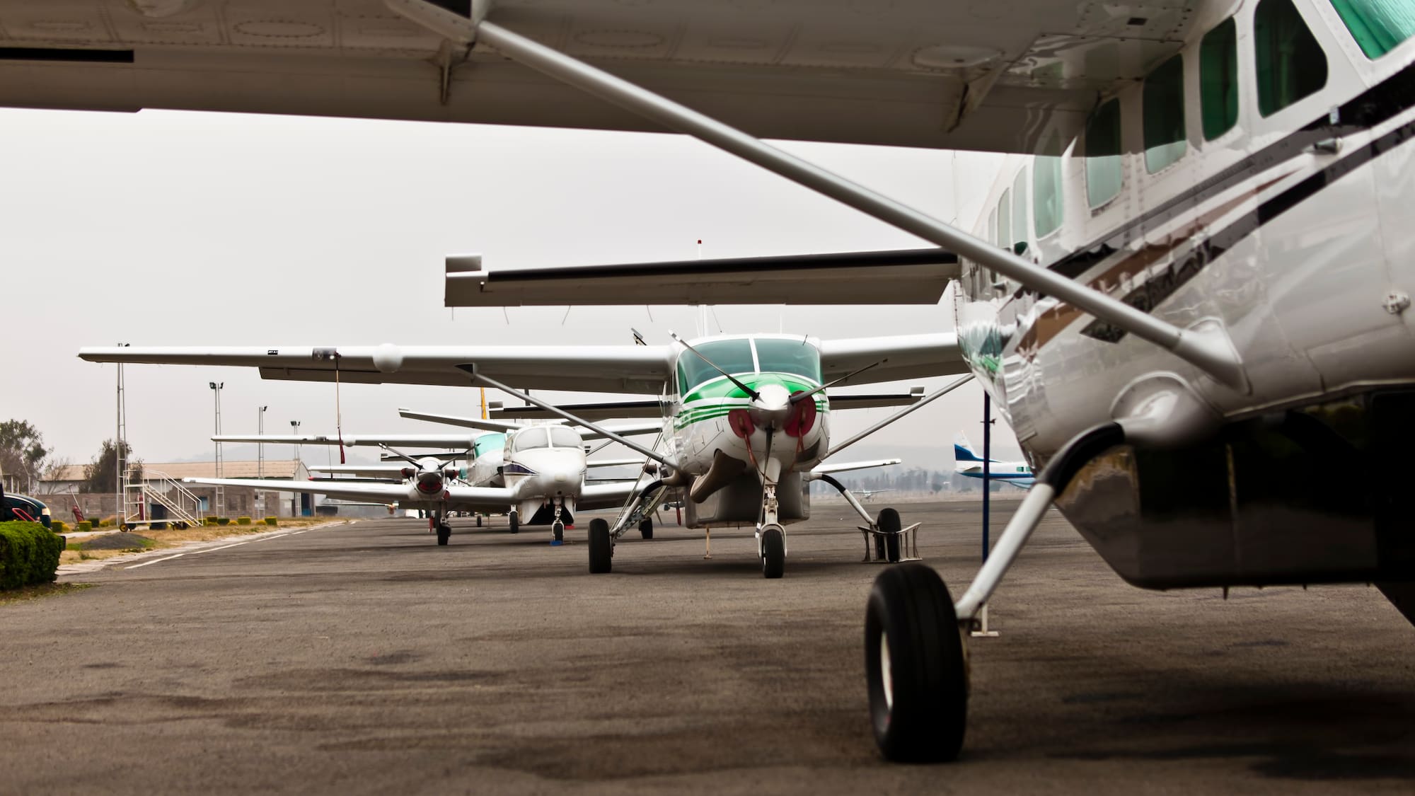 a group of airplanes on a runway