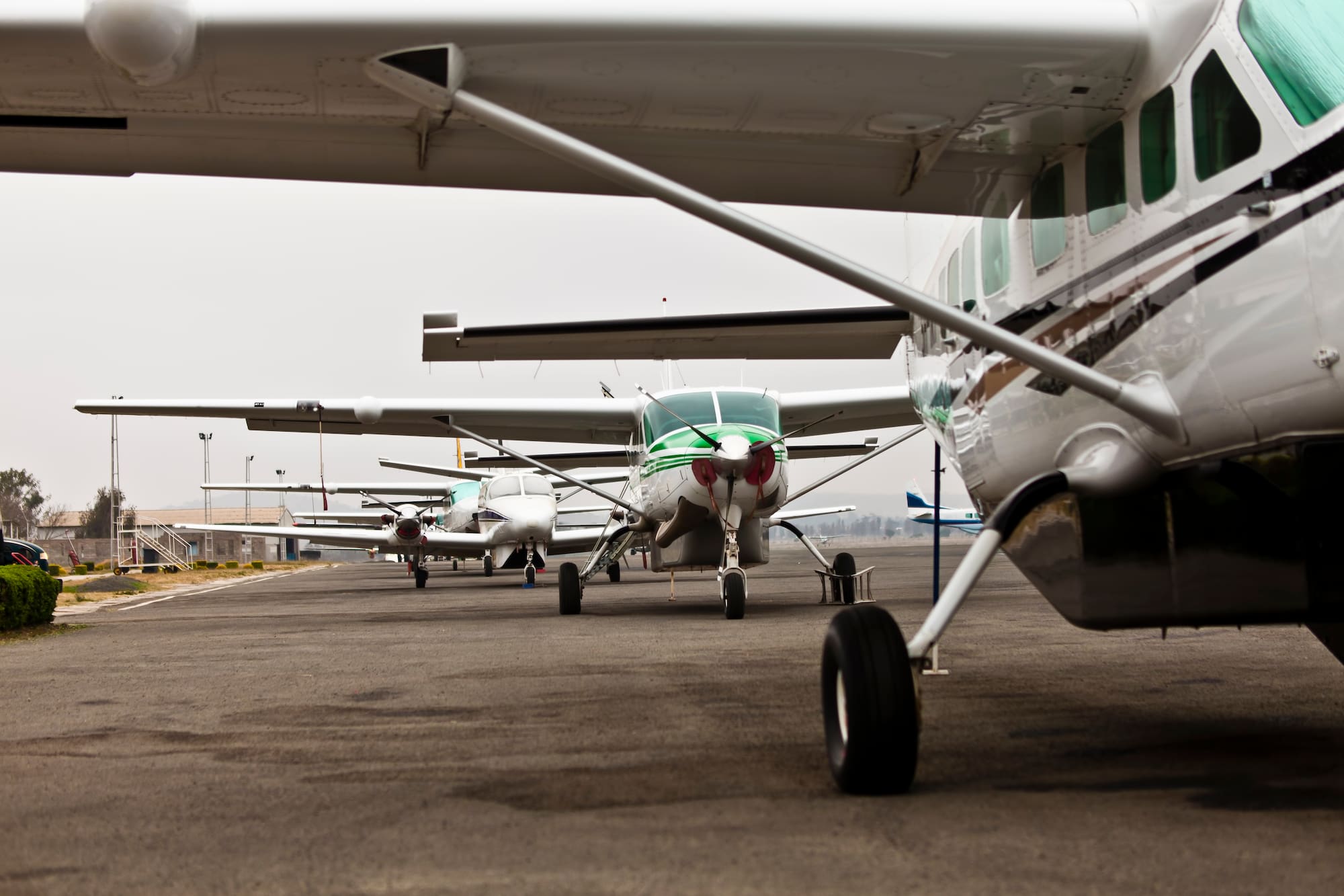 a group of airplanes on a runway