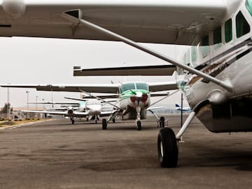 a group of airplanes on a runway