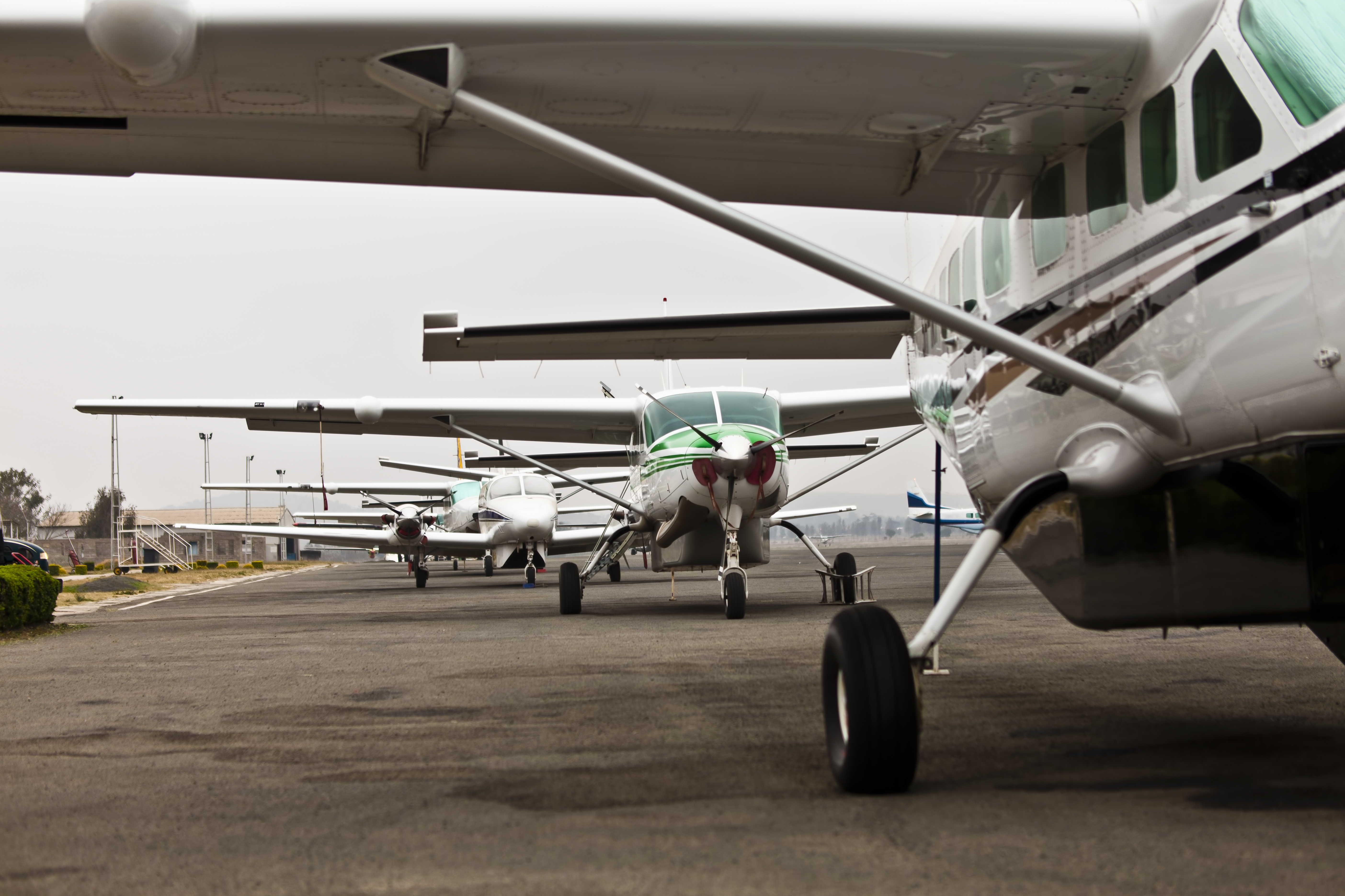 a group of airplanes on a runway