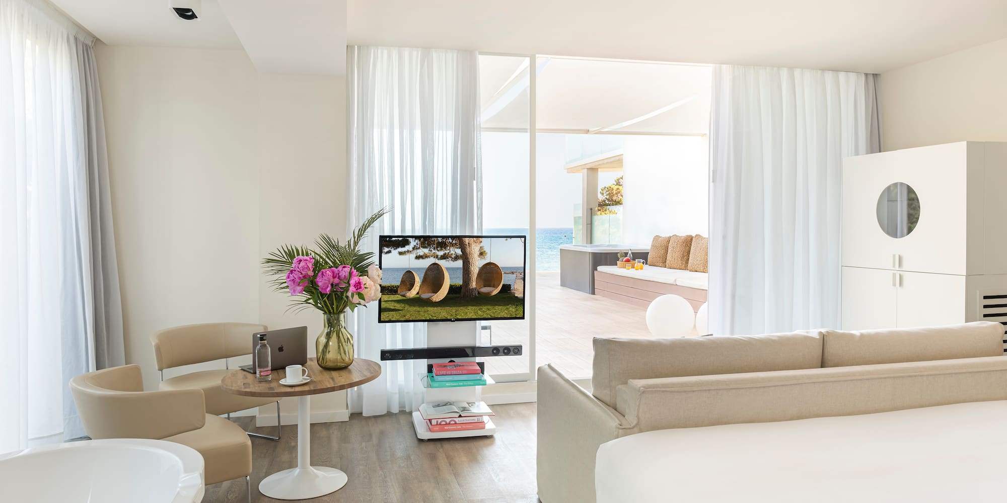 a room with a television and a tub