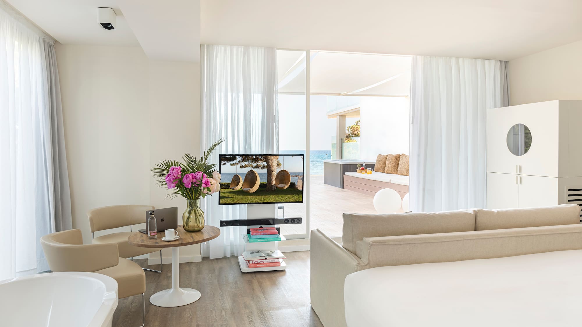 a room with a television and a tub