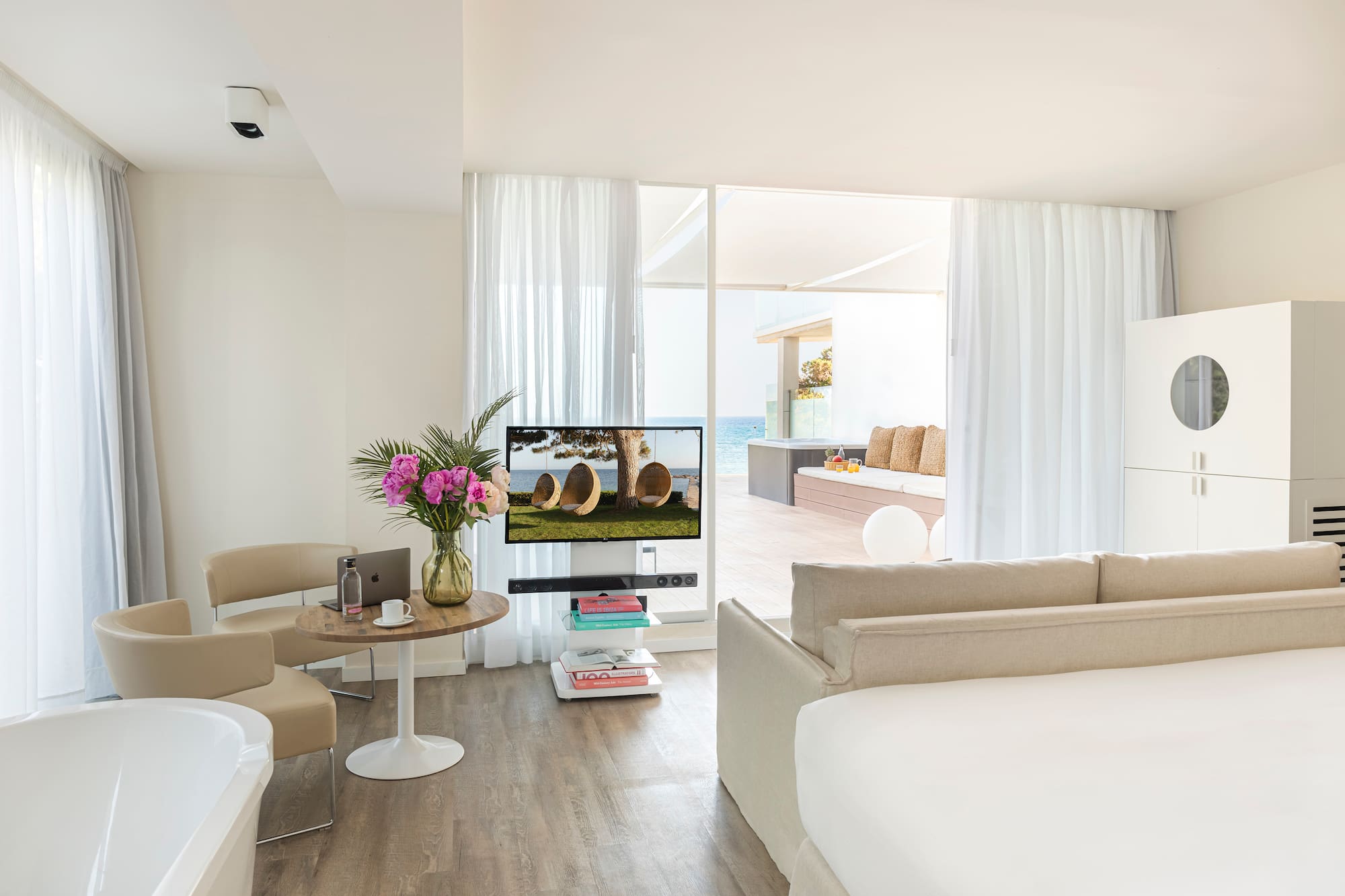 a room with a television and a tub