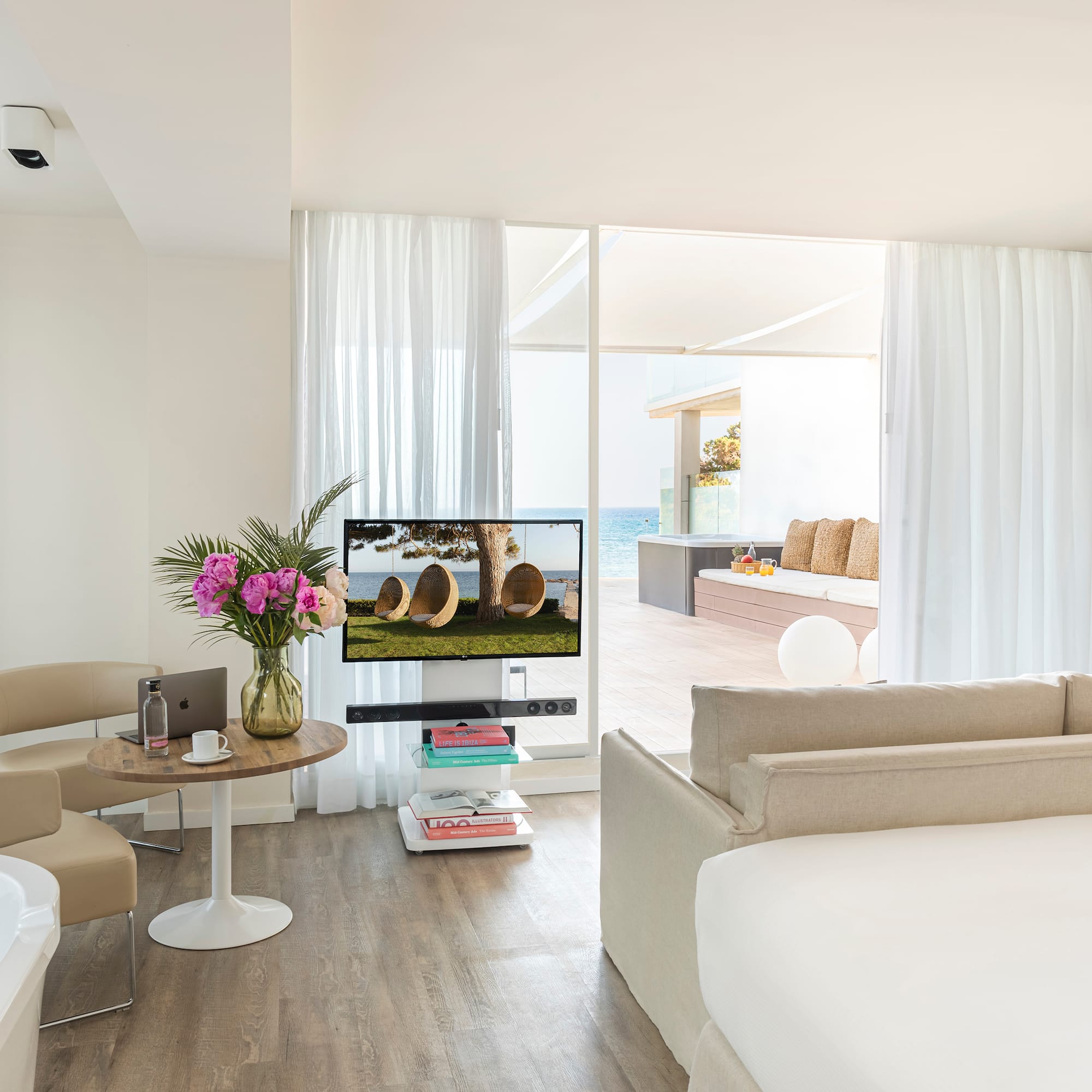 a room with a television and a tub