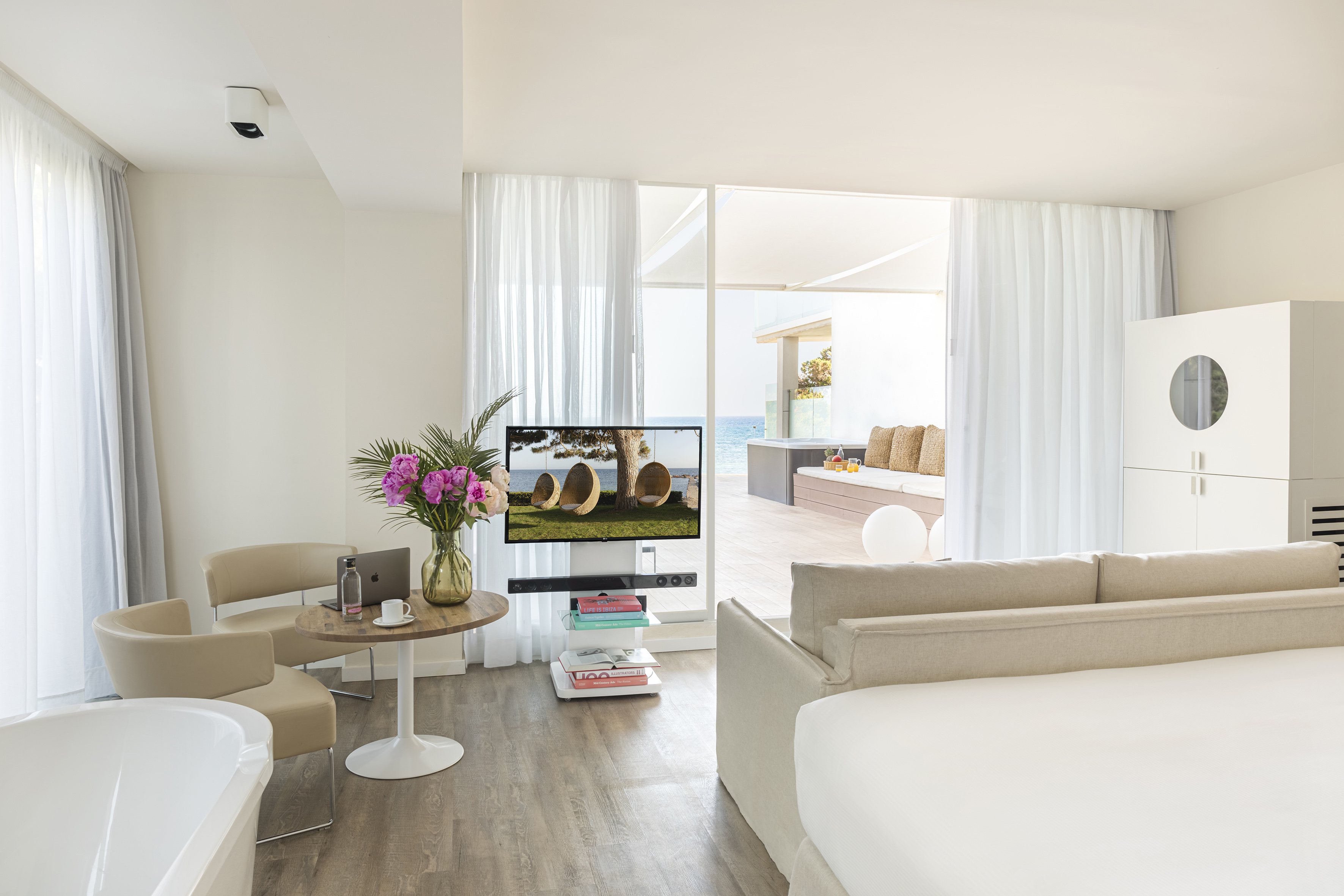 a room with a television and a tub