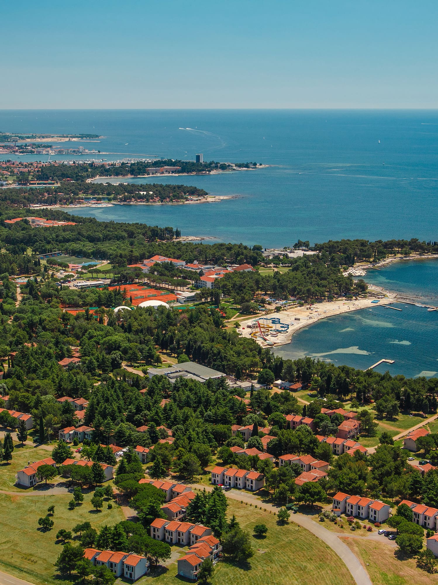 a aerial view of a town by the water