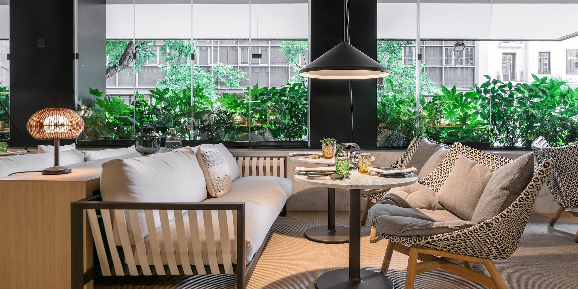 a room with a couch and chairs