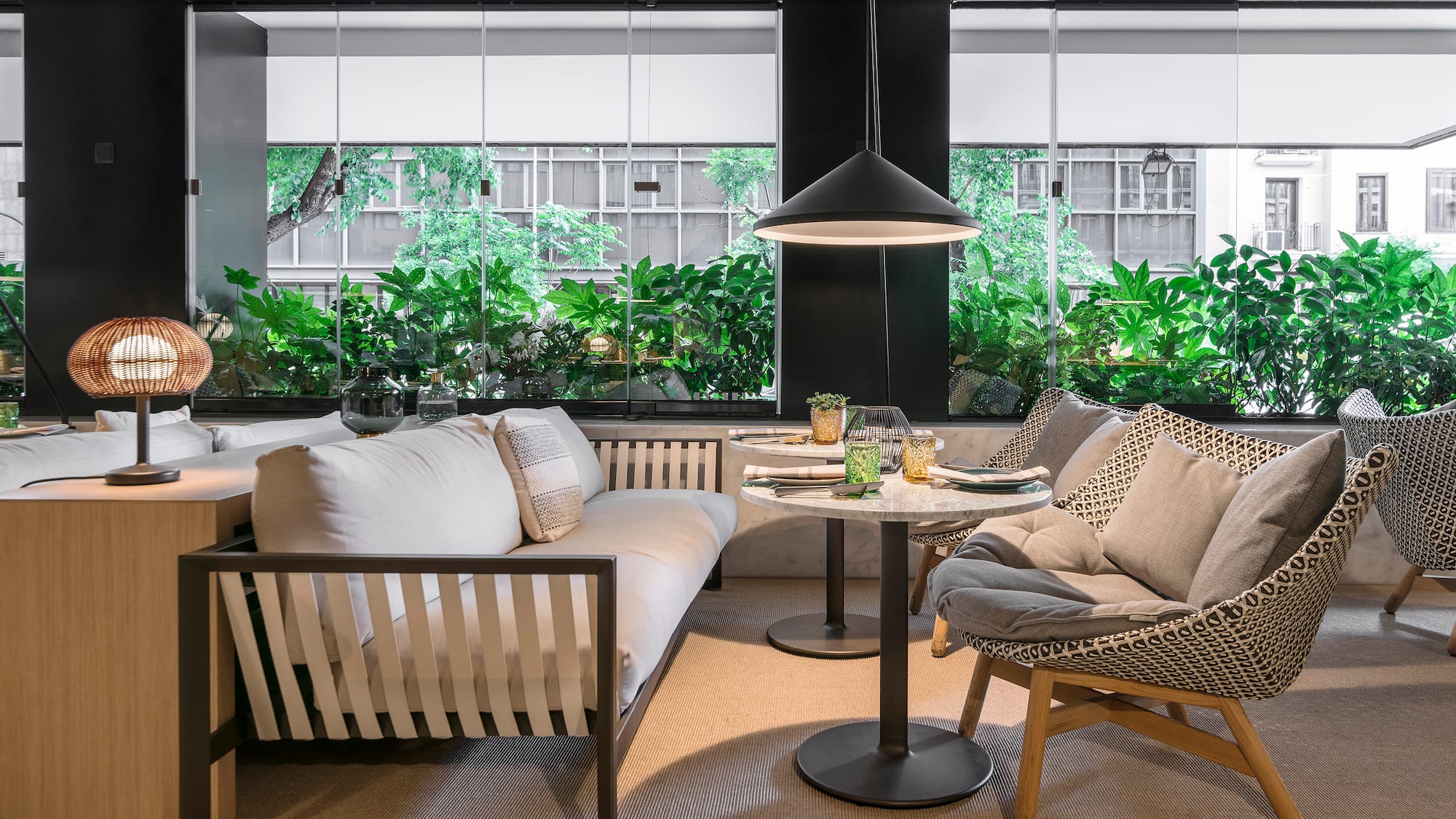 a room with a couch and chairs