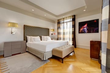 a bedroom with a bed and a dresser