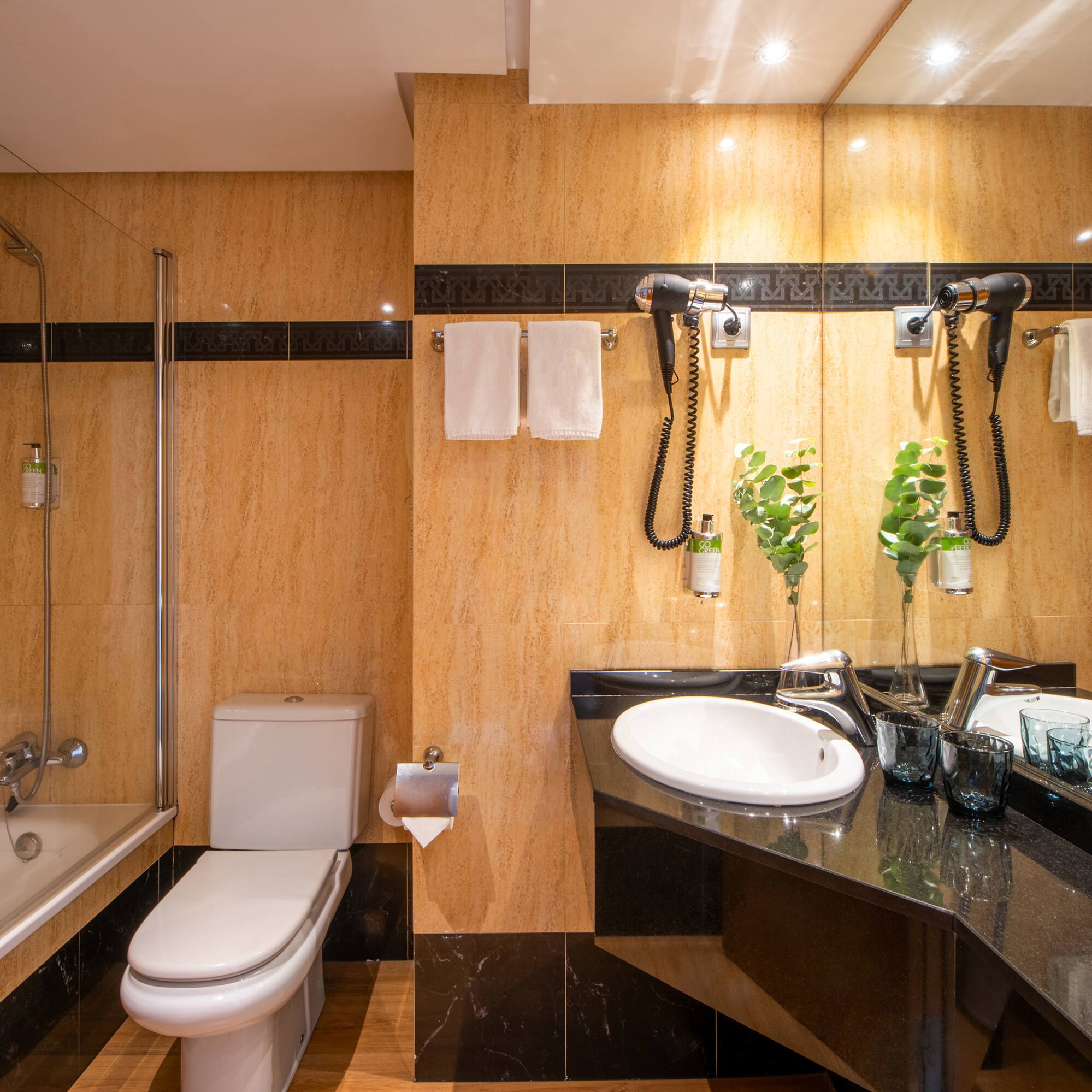 a bathroom with a sink and shower