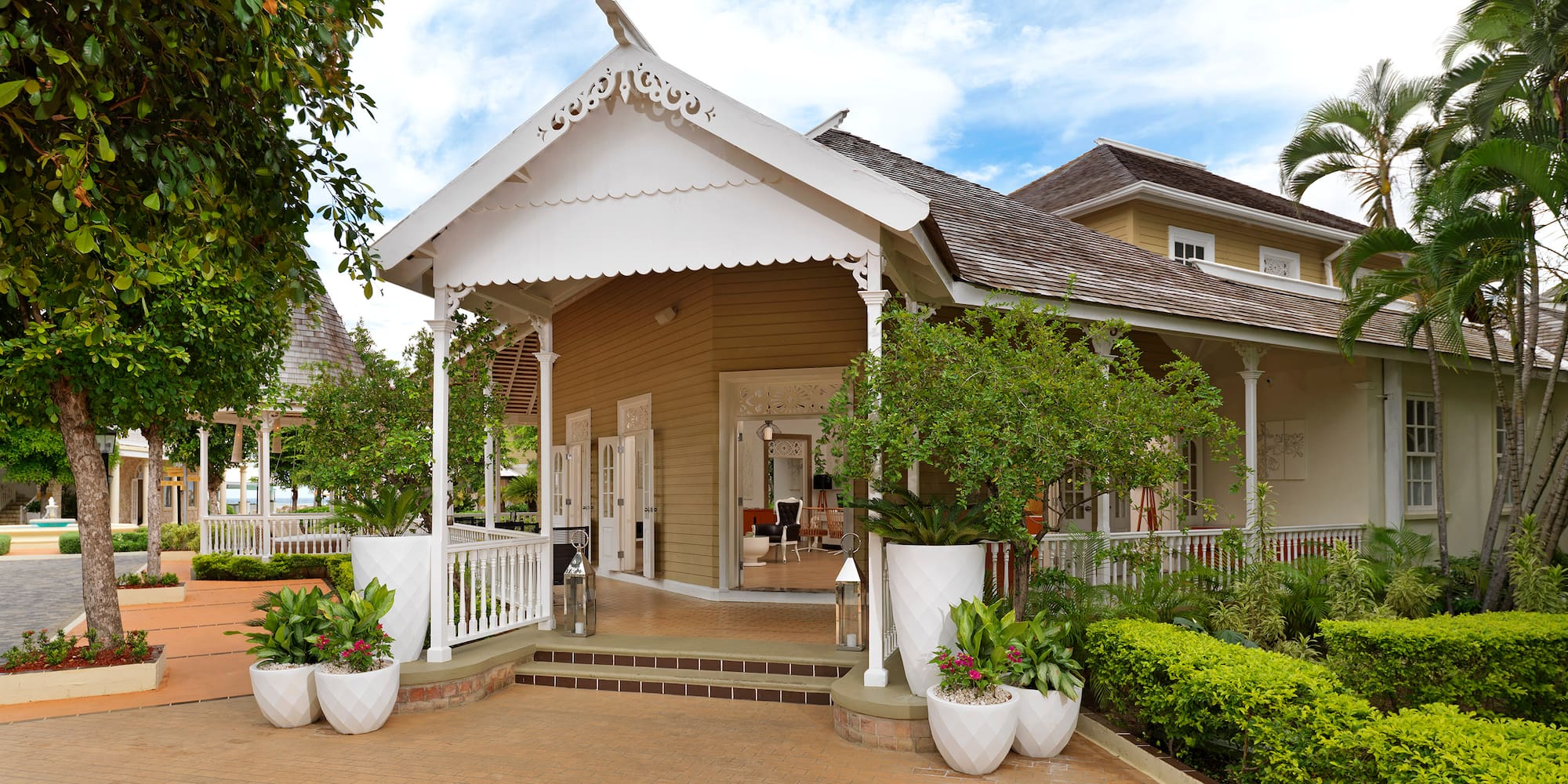 a house with a white roof and a white railing
