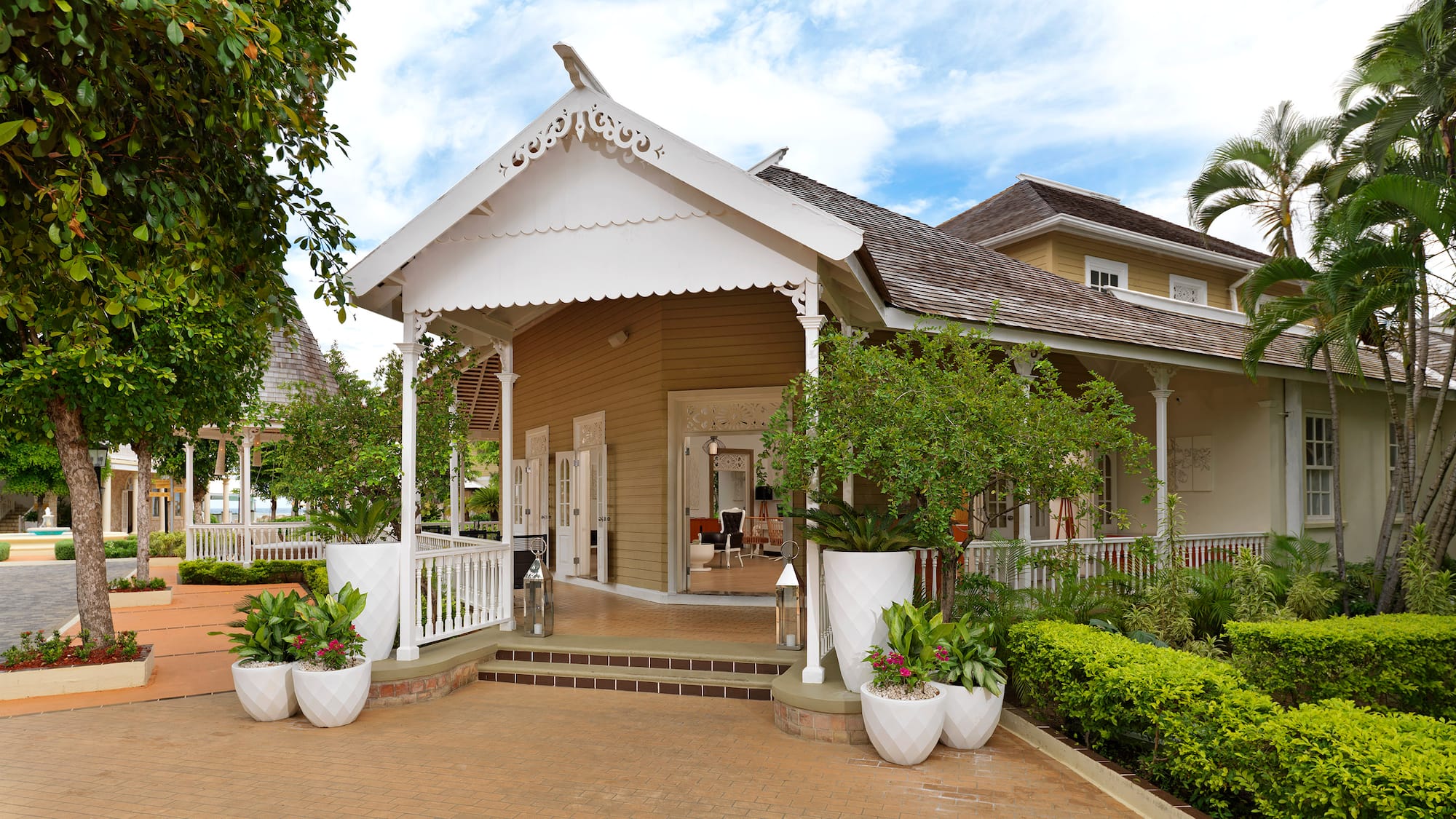a house with a white roof and a white railing