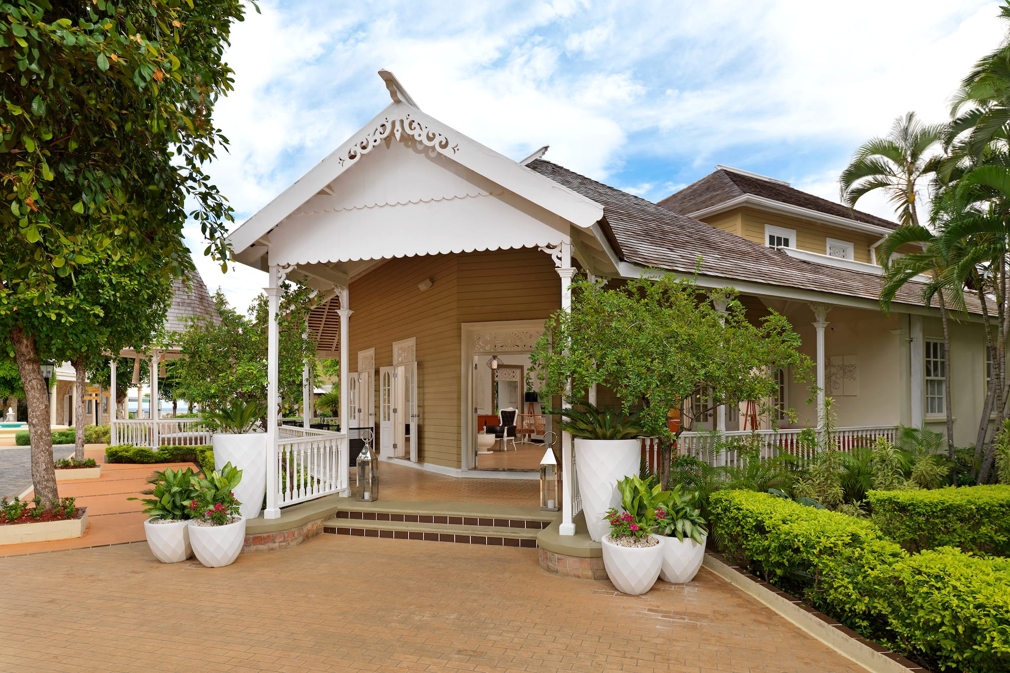 a house with a white roof and a white railing