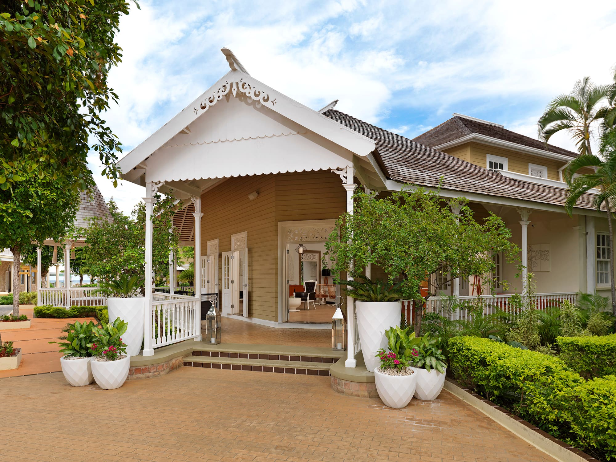 a house with a white roof and a white railing