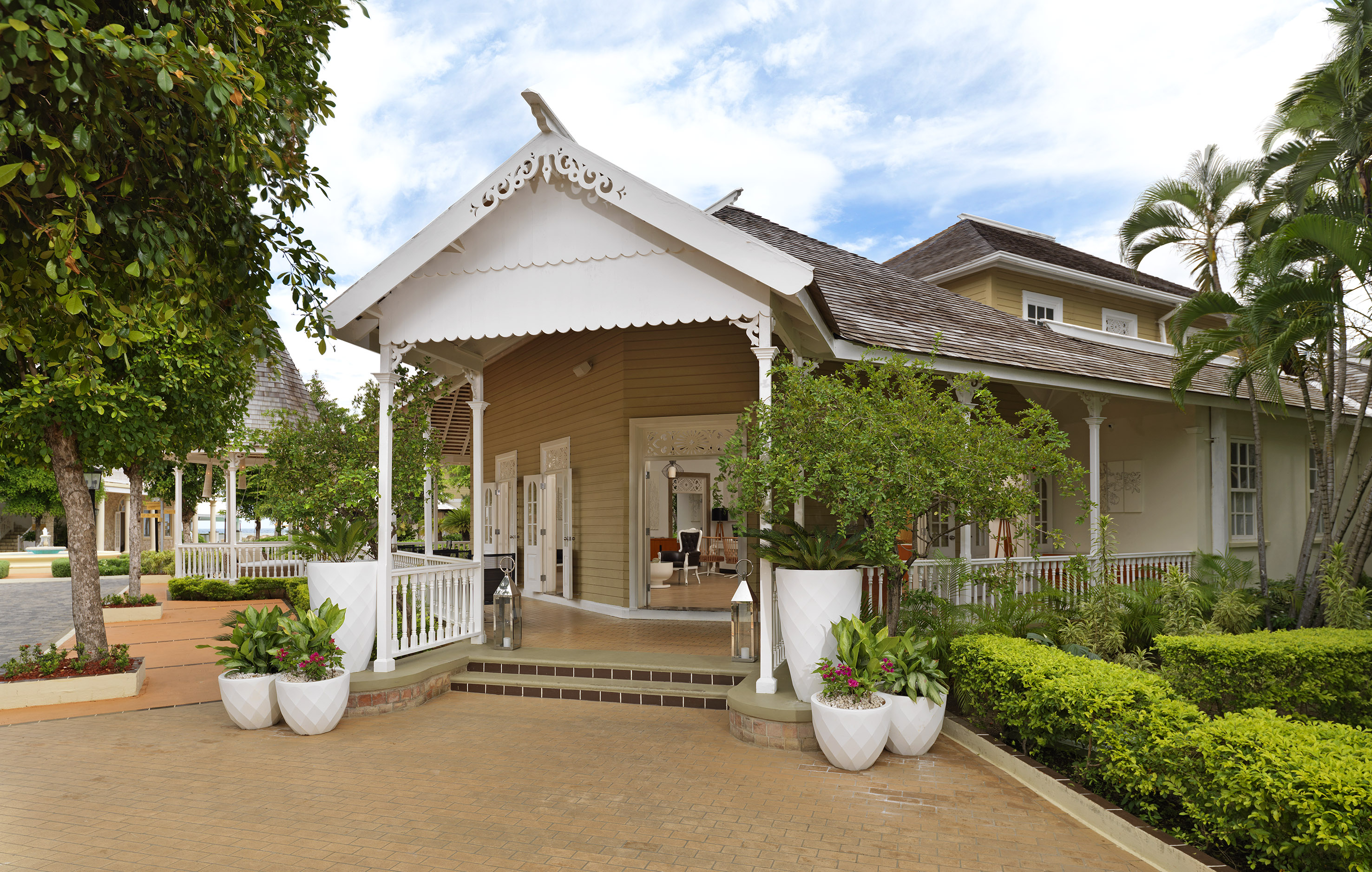 a house with a white roof and a white railing