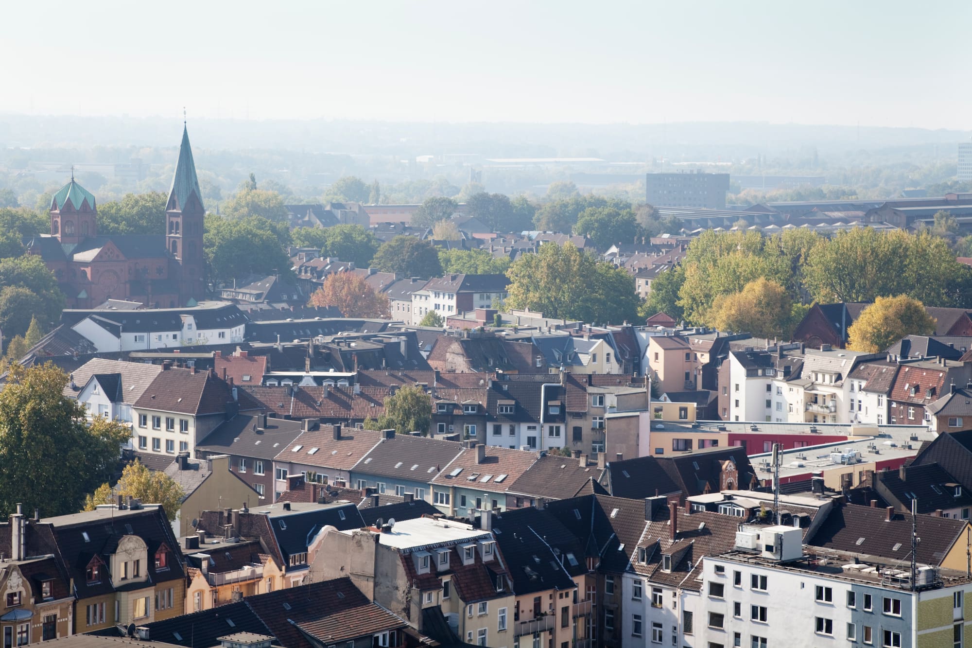 a city with many buildings and trees