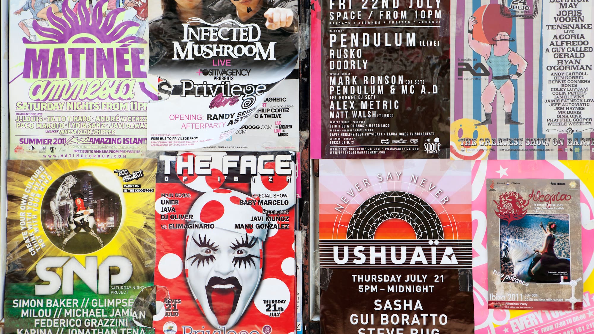 a group of posters on a wall