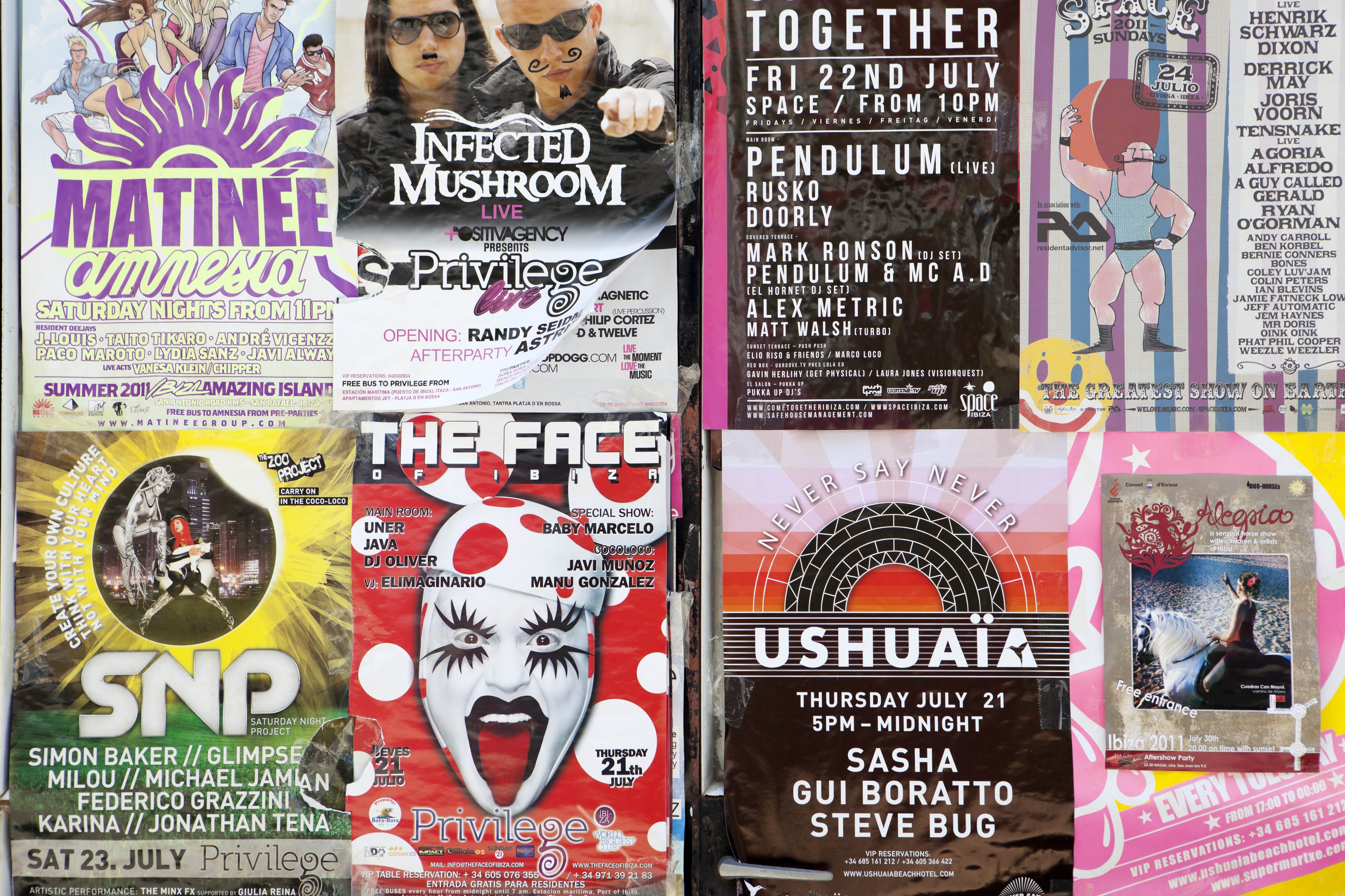 a group of posters on a wall