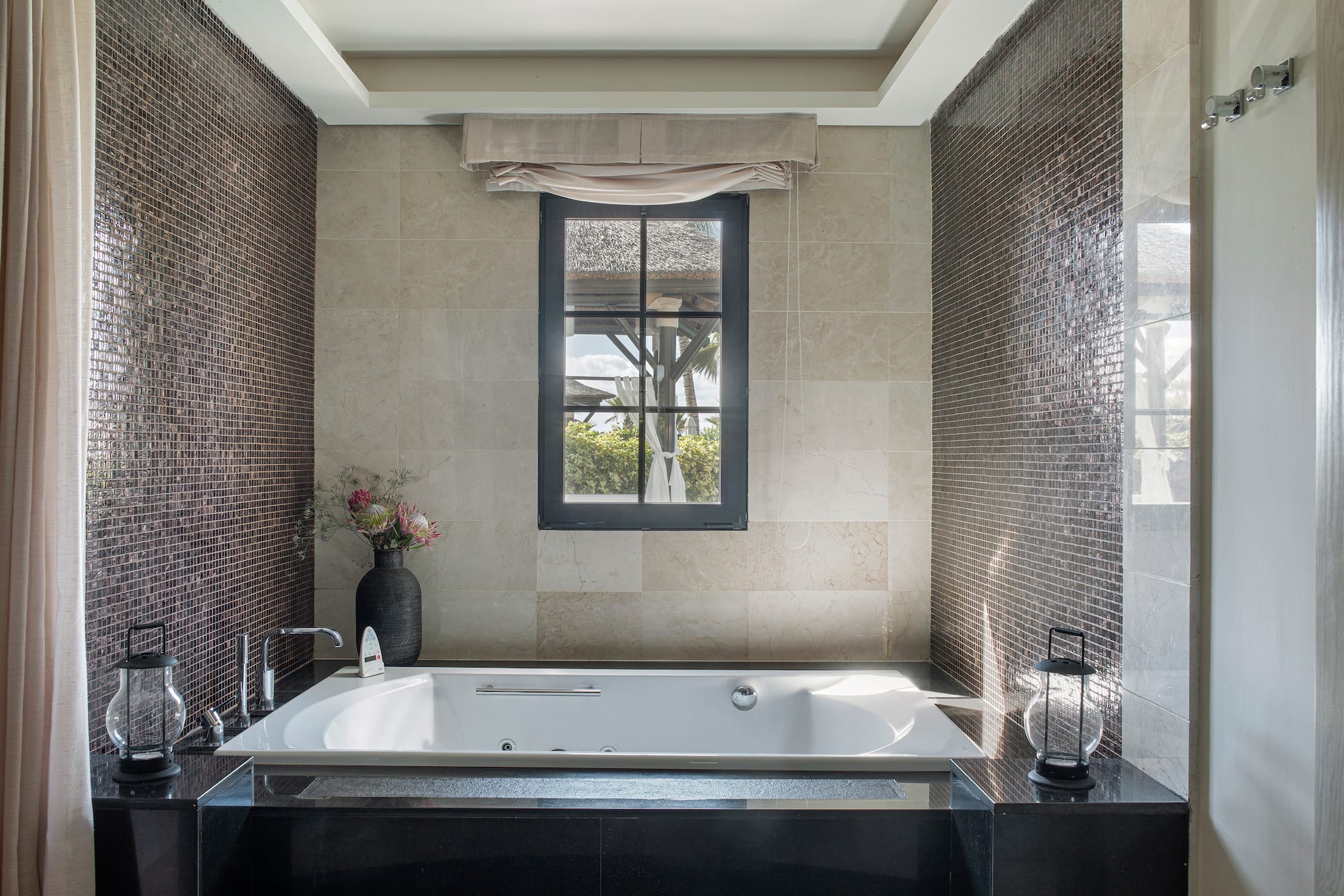 a bathroom with a tub and a window