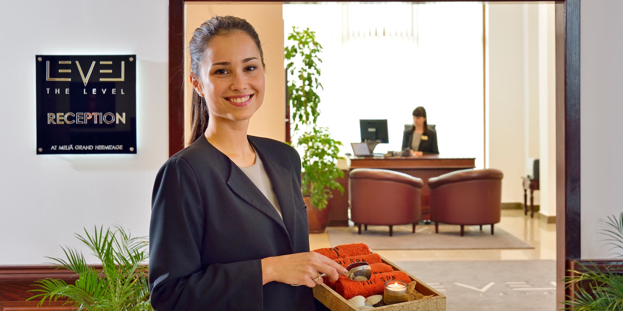 a woman holding a tray of food