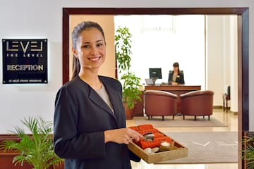 a woman holding a tray of food