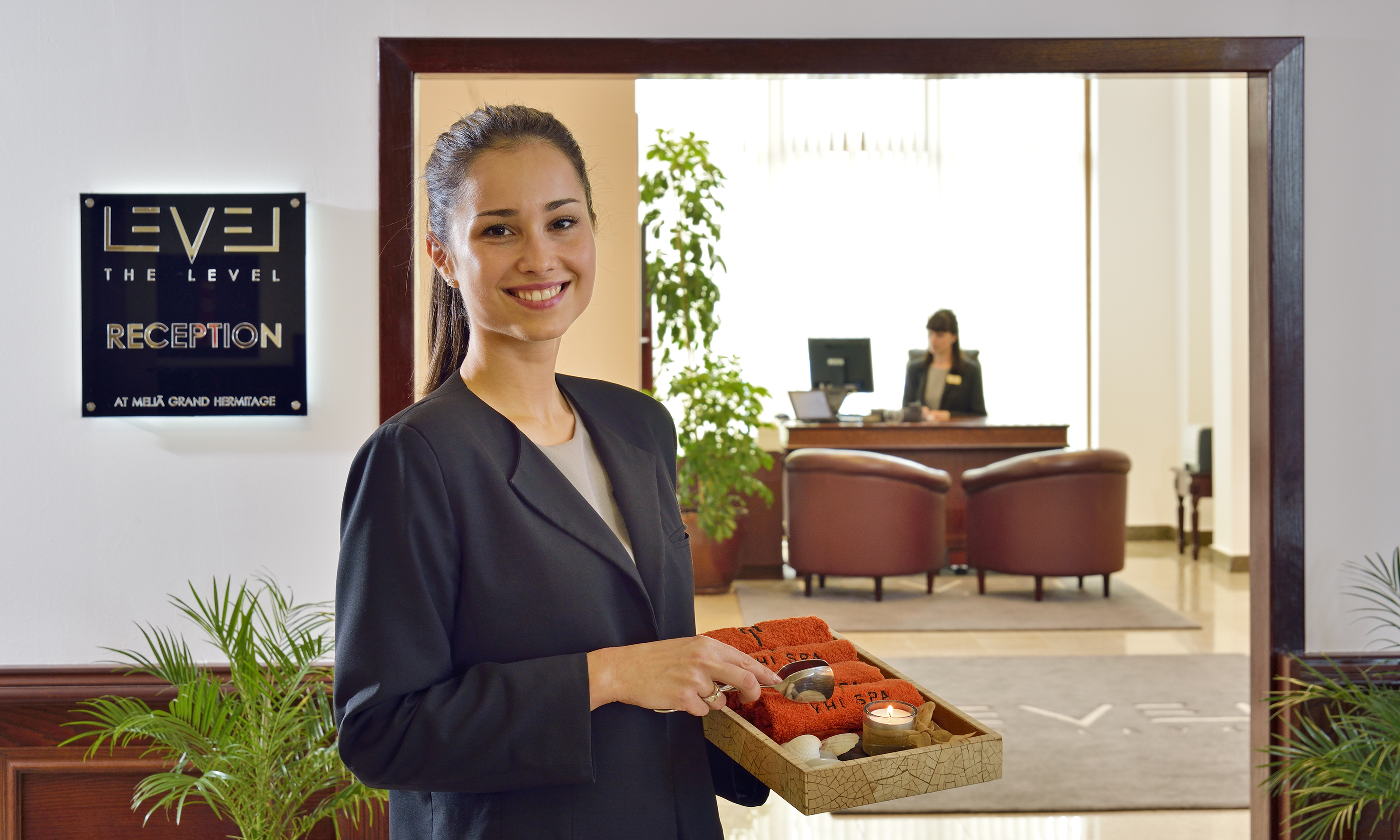 a woman holding a tray of food