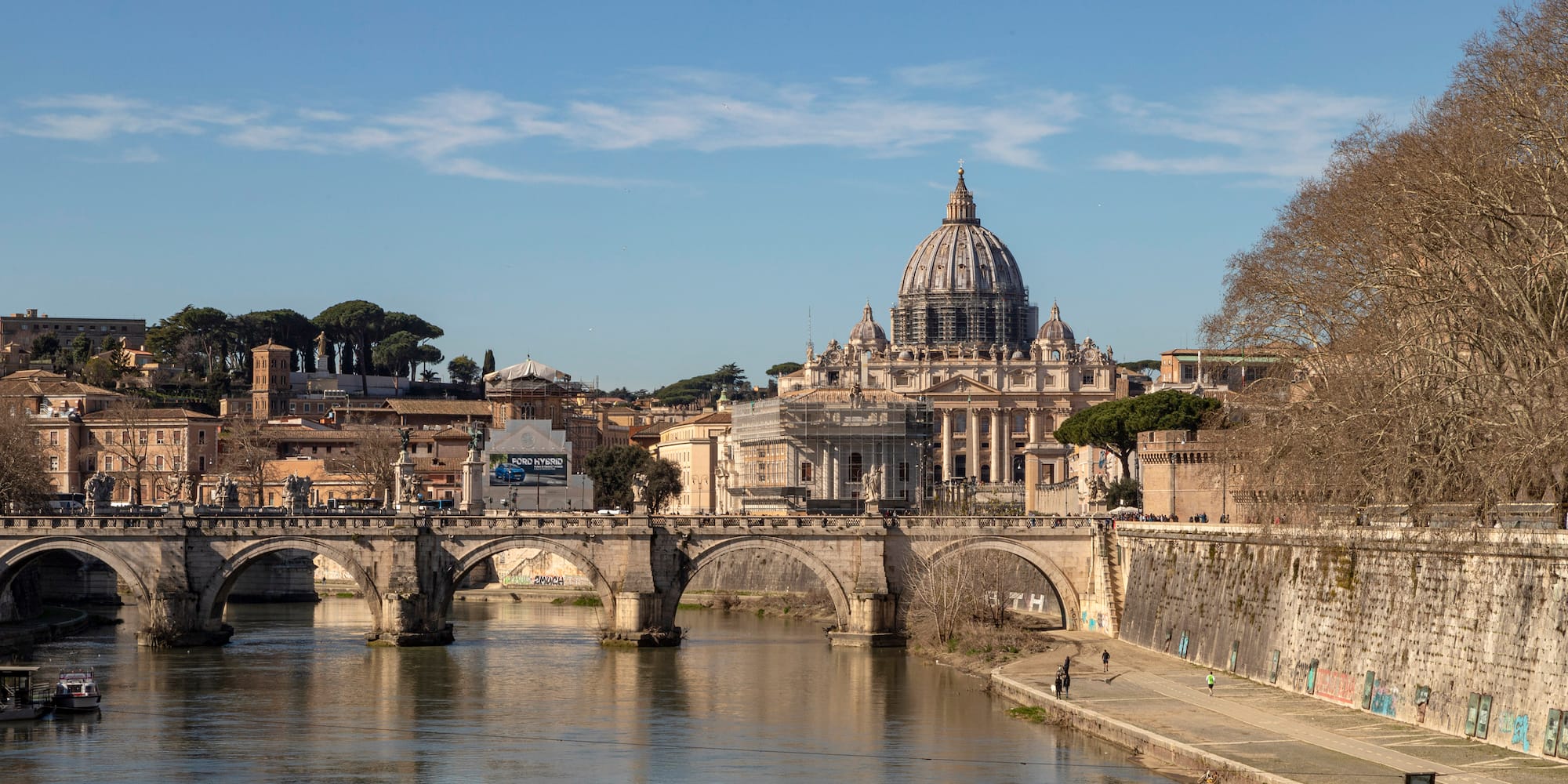 Tiber over a river with a large building in the background