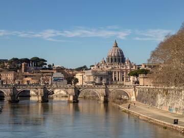 Tiber over a river with a large building in the background