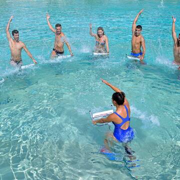 a group of people in a body of water