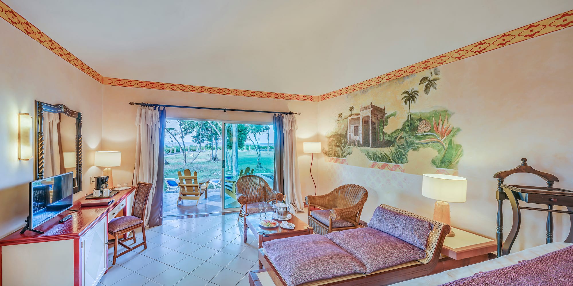 a room with a couch and chairs