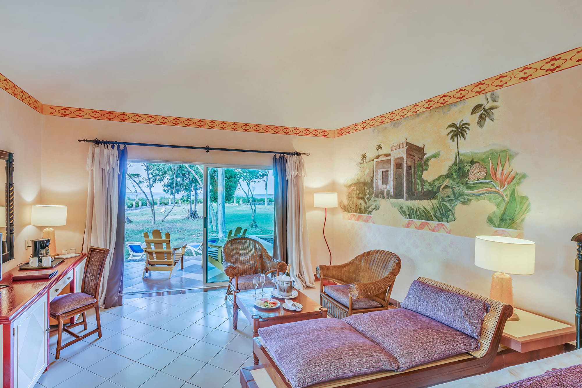 a room with a couch and chairs