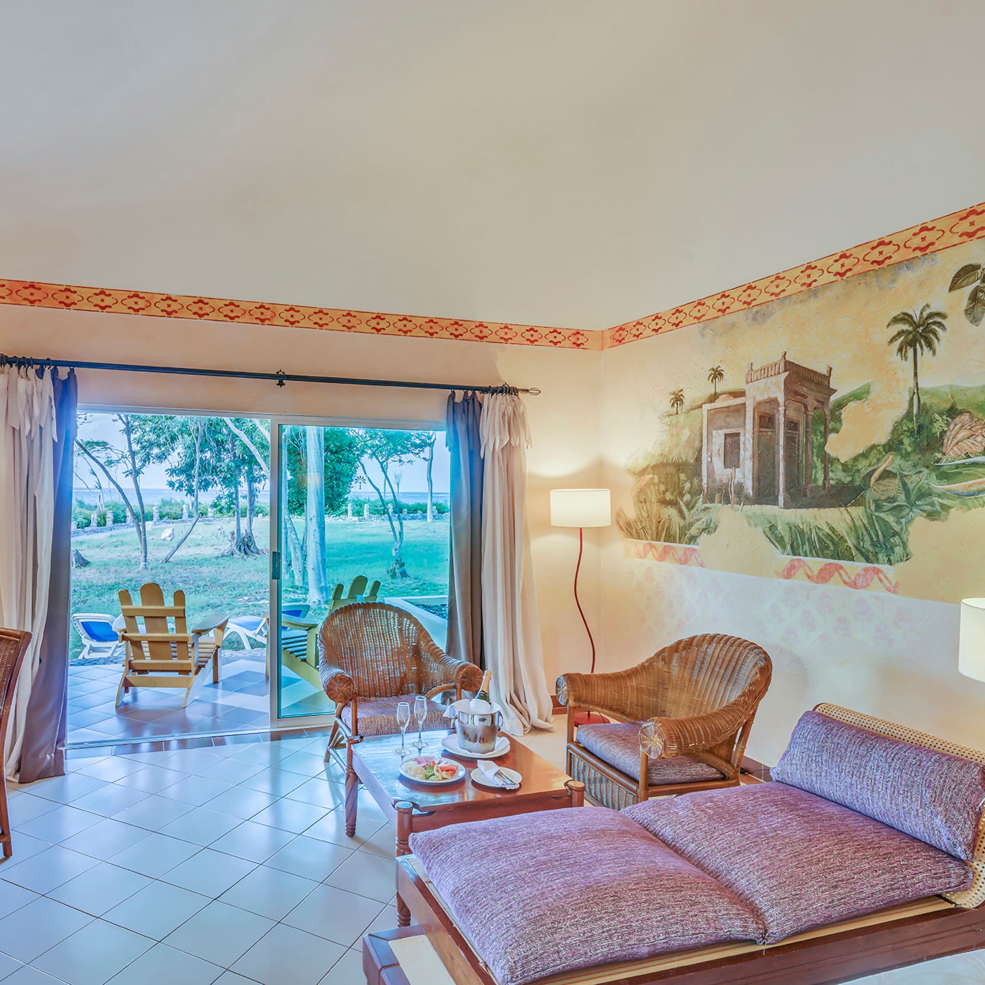 a room with a couch and chairs