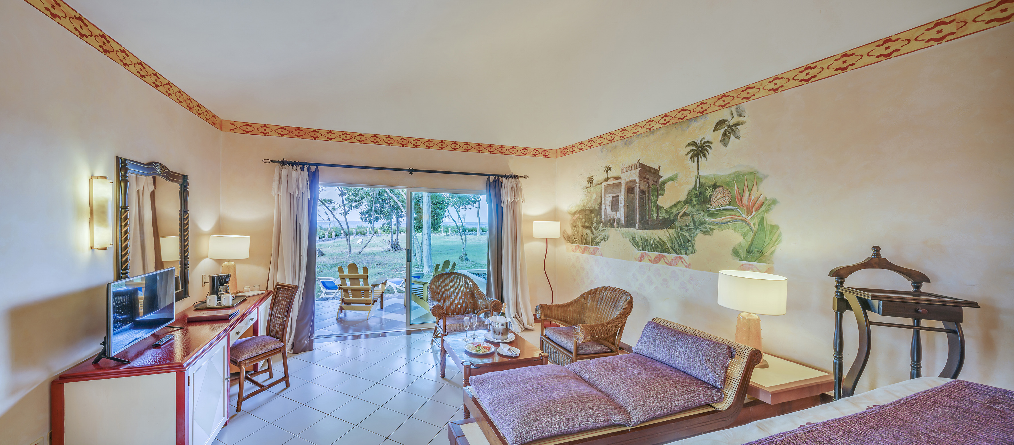 a room with a couch and chairs