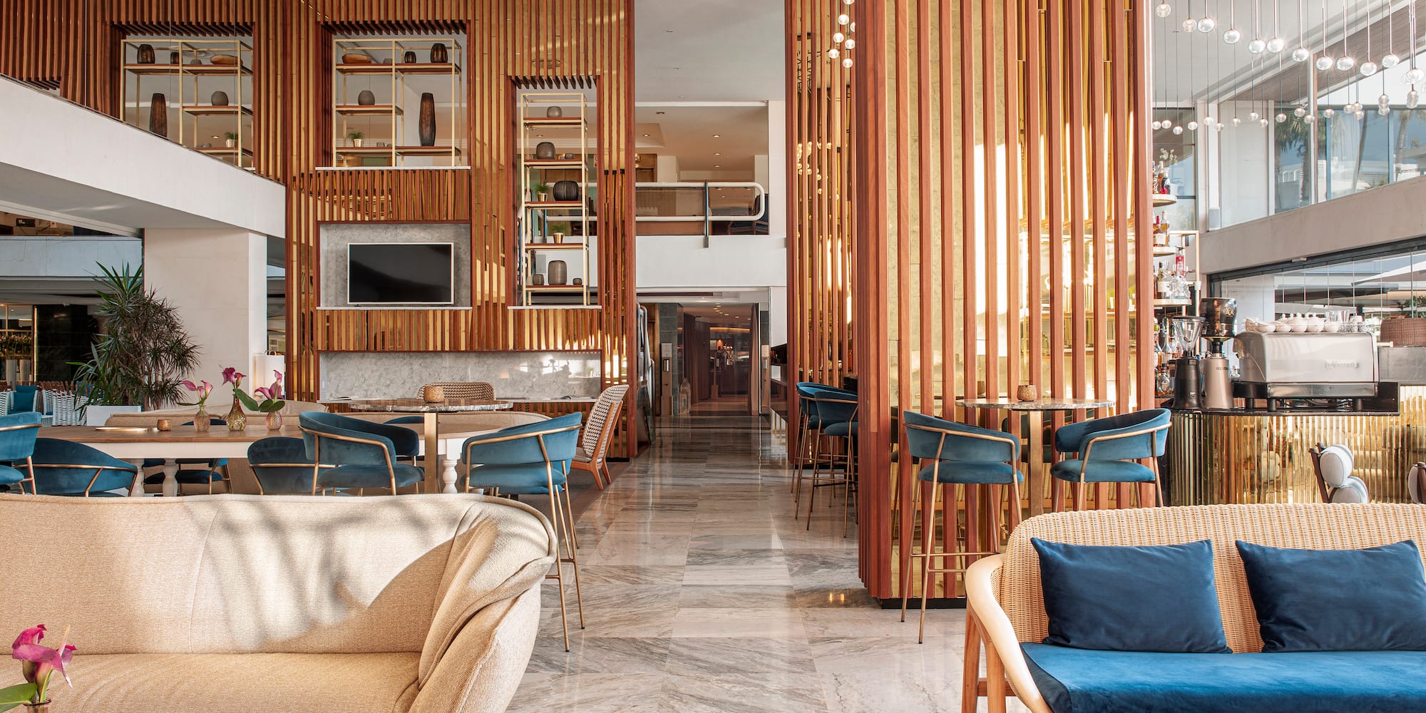 a room with a large wall and chairs