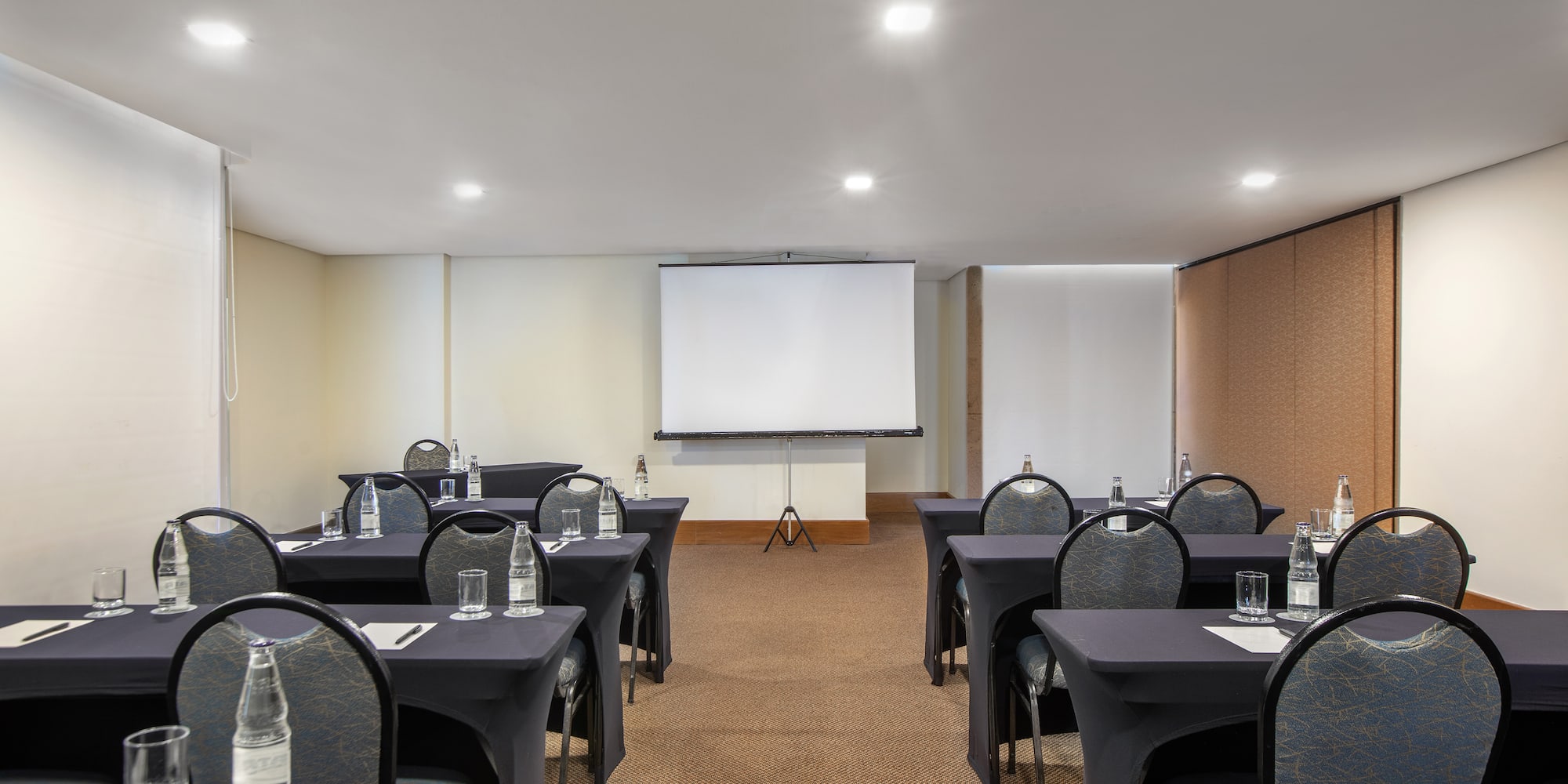 a room with tables and chairs