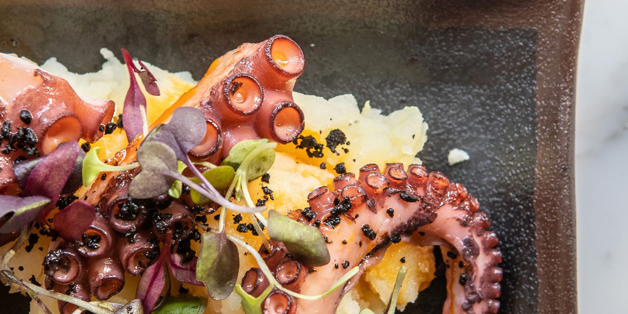 a plate of food on a marble surface