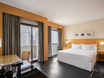 a room with a bed and a desk