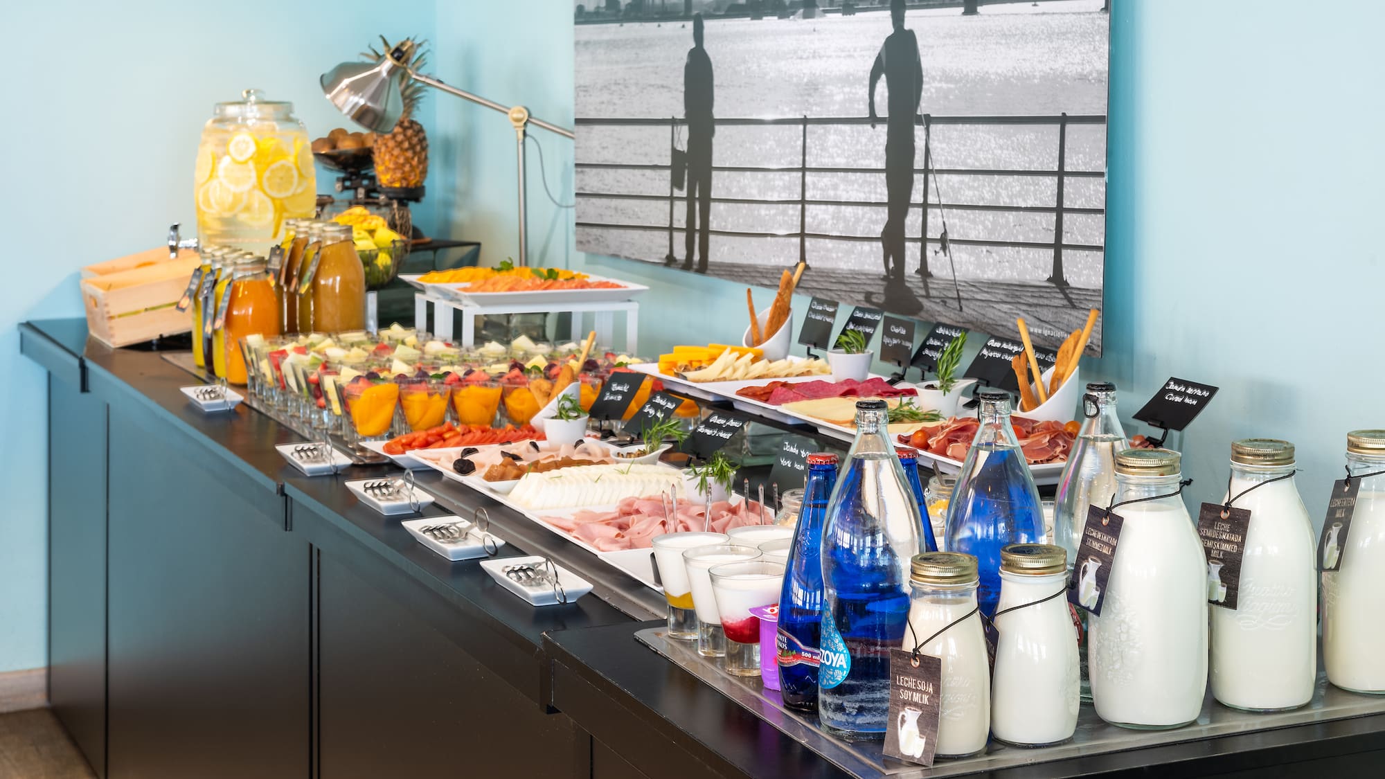 a buffet table with food and drinks