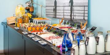 a buffet table with food and drinks