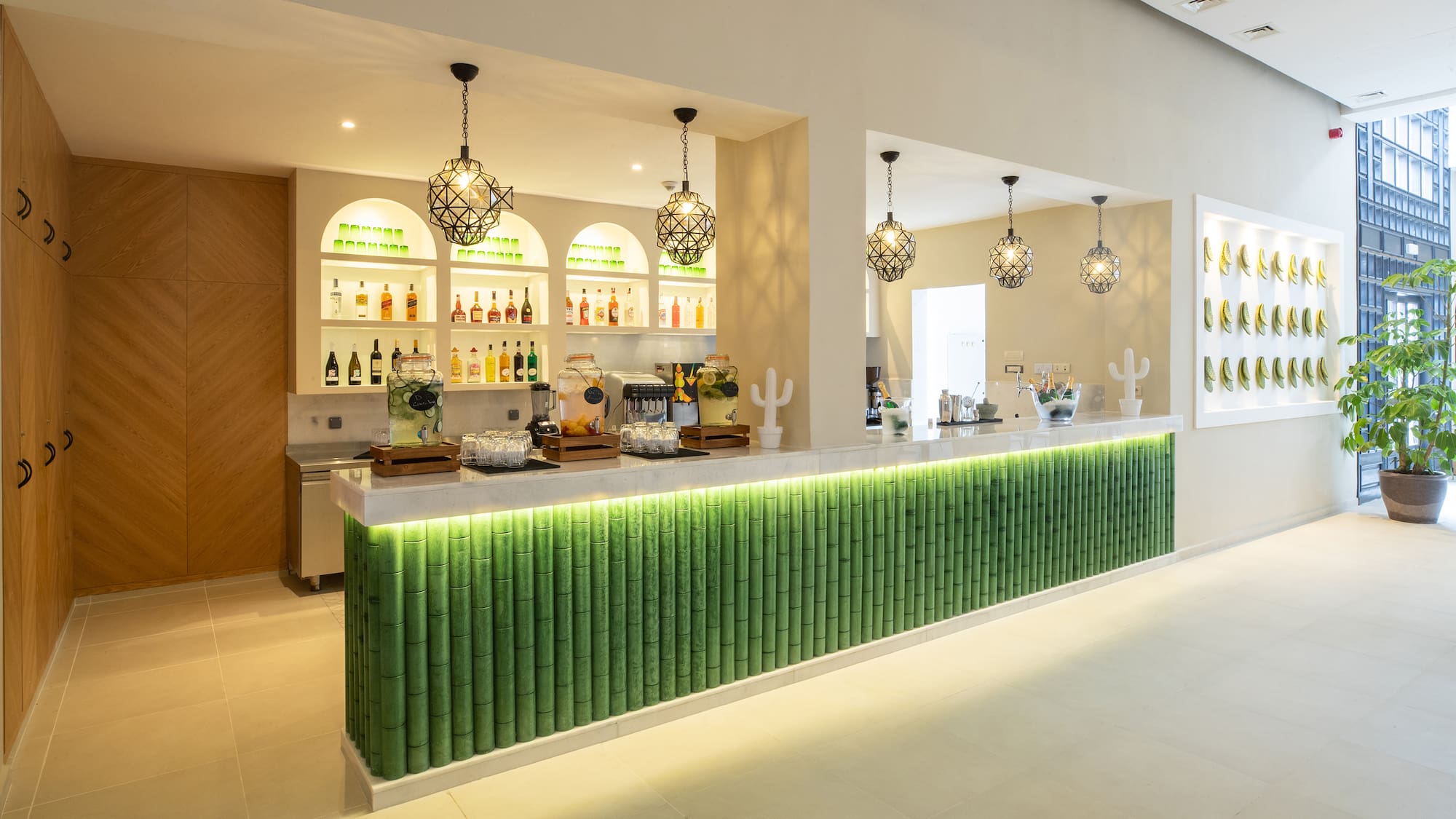 a bar with green and white bamboo walls