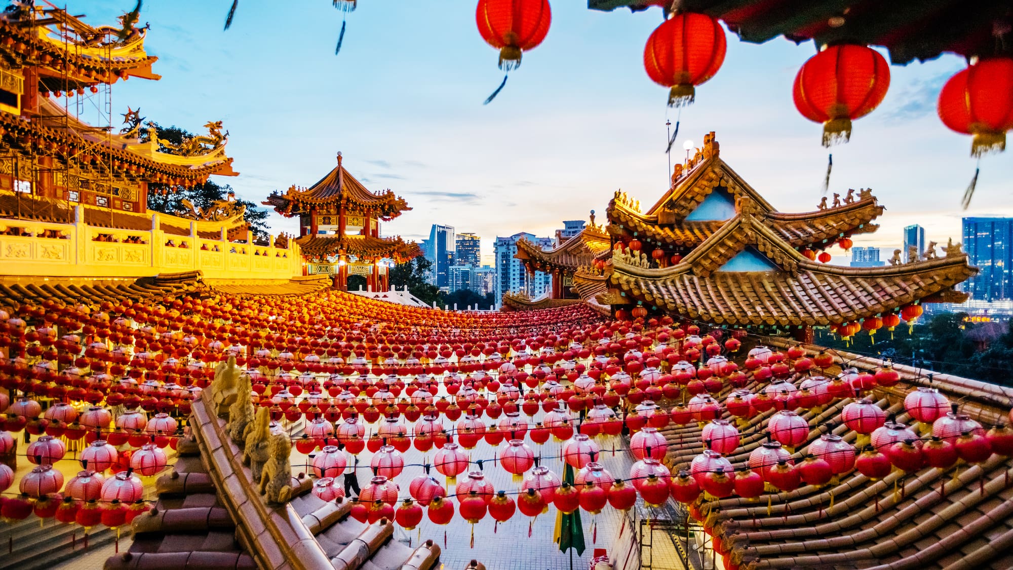 a large asian building with red lanterns